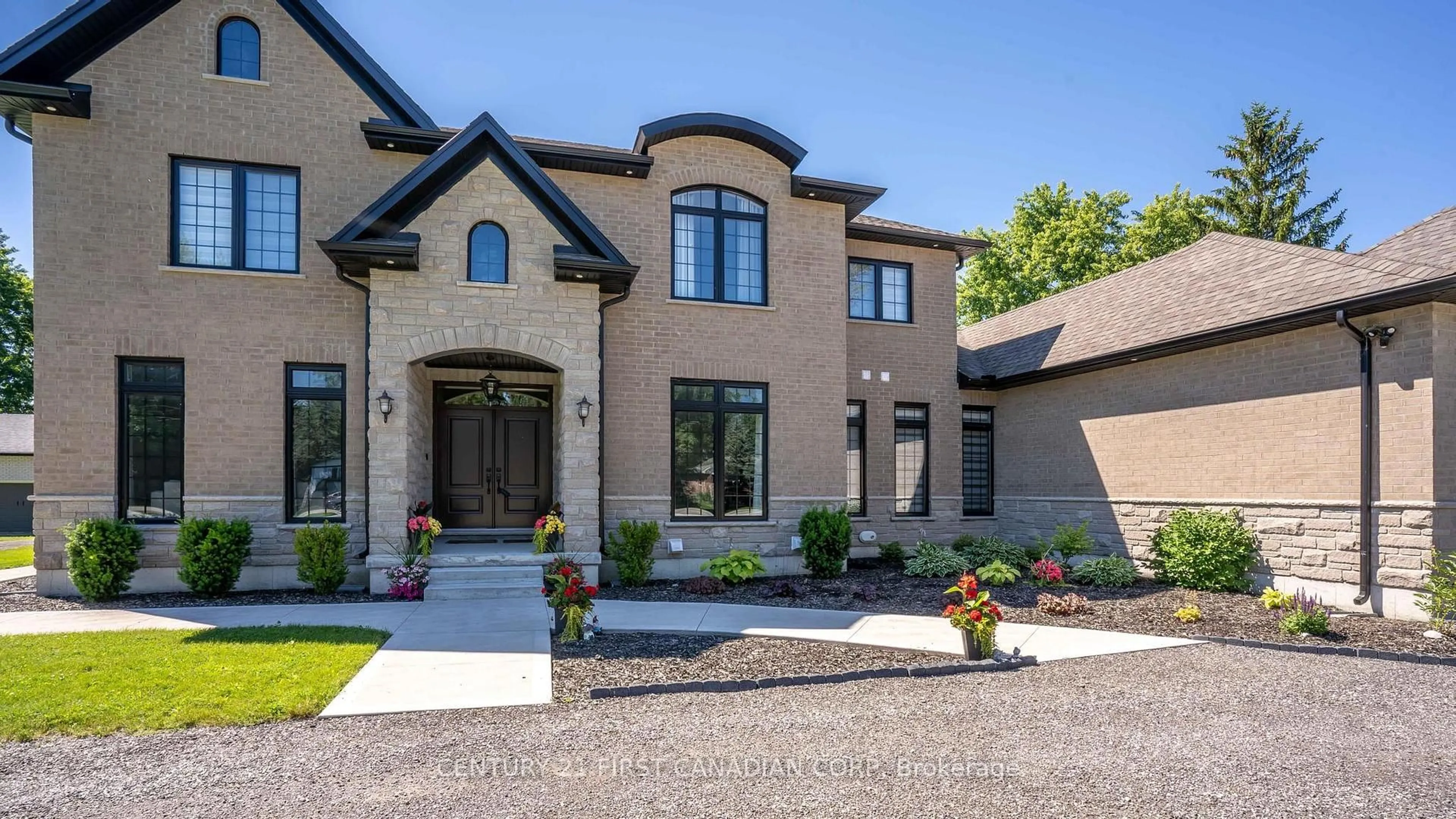 Home with brick exterior material, street for 15257 Twelve Mile Rd, Middlesex Centre Ontario N0M 2A0