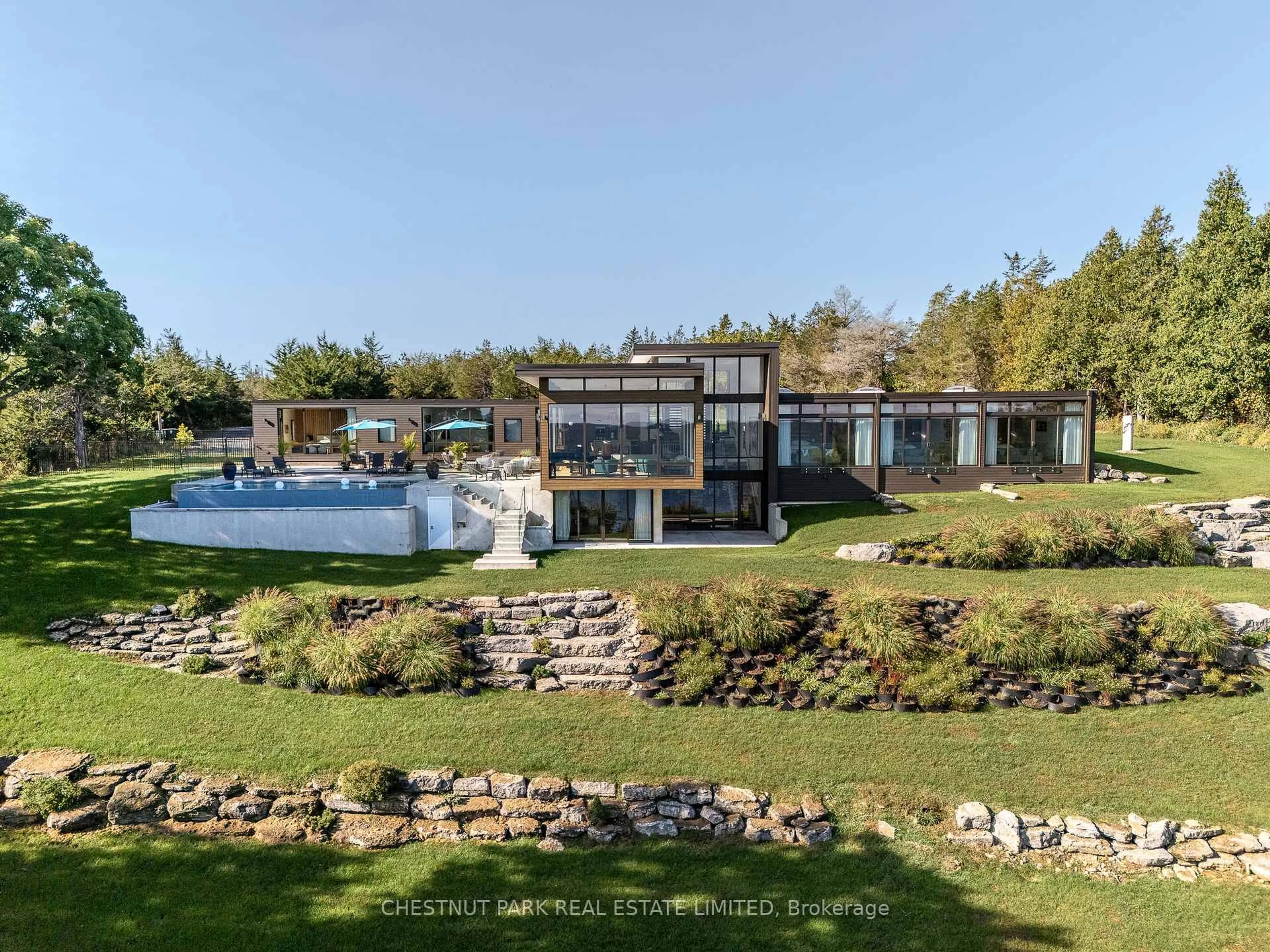 A pic from outside/outdoor area/front of a property/back of a property/a pic from drone, water/lake/river/ocean view for 1641 County Road 13, Prince Edward County Ontario K0K 2P0