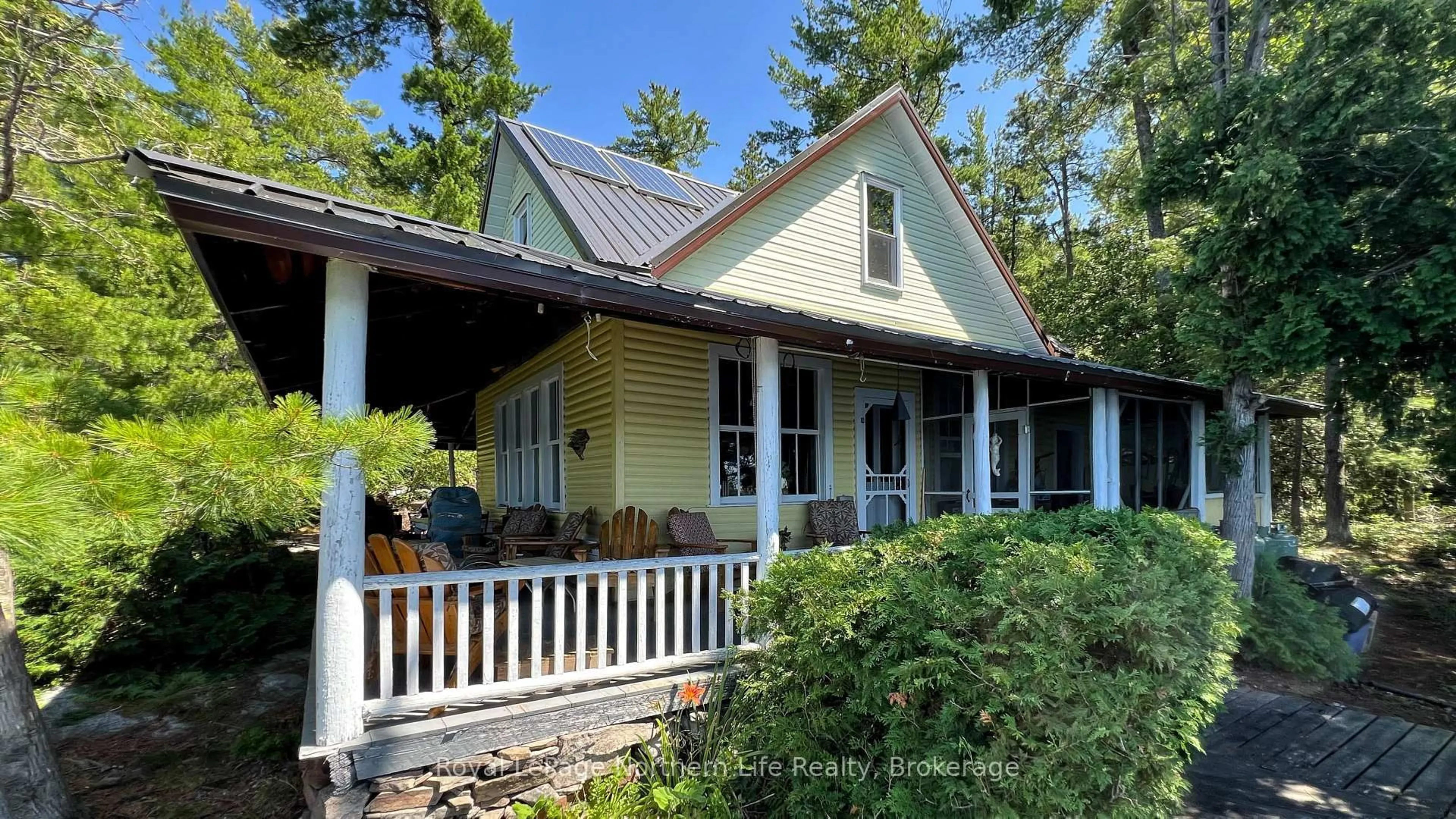 Home with vinyl exterior material, street for 140 Norris Island, Parry Sound Remote Area Ontario P0M 2N1