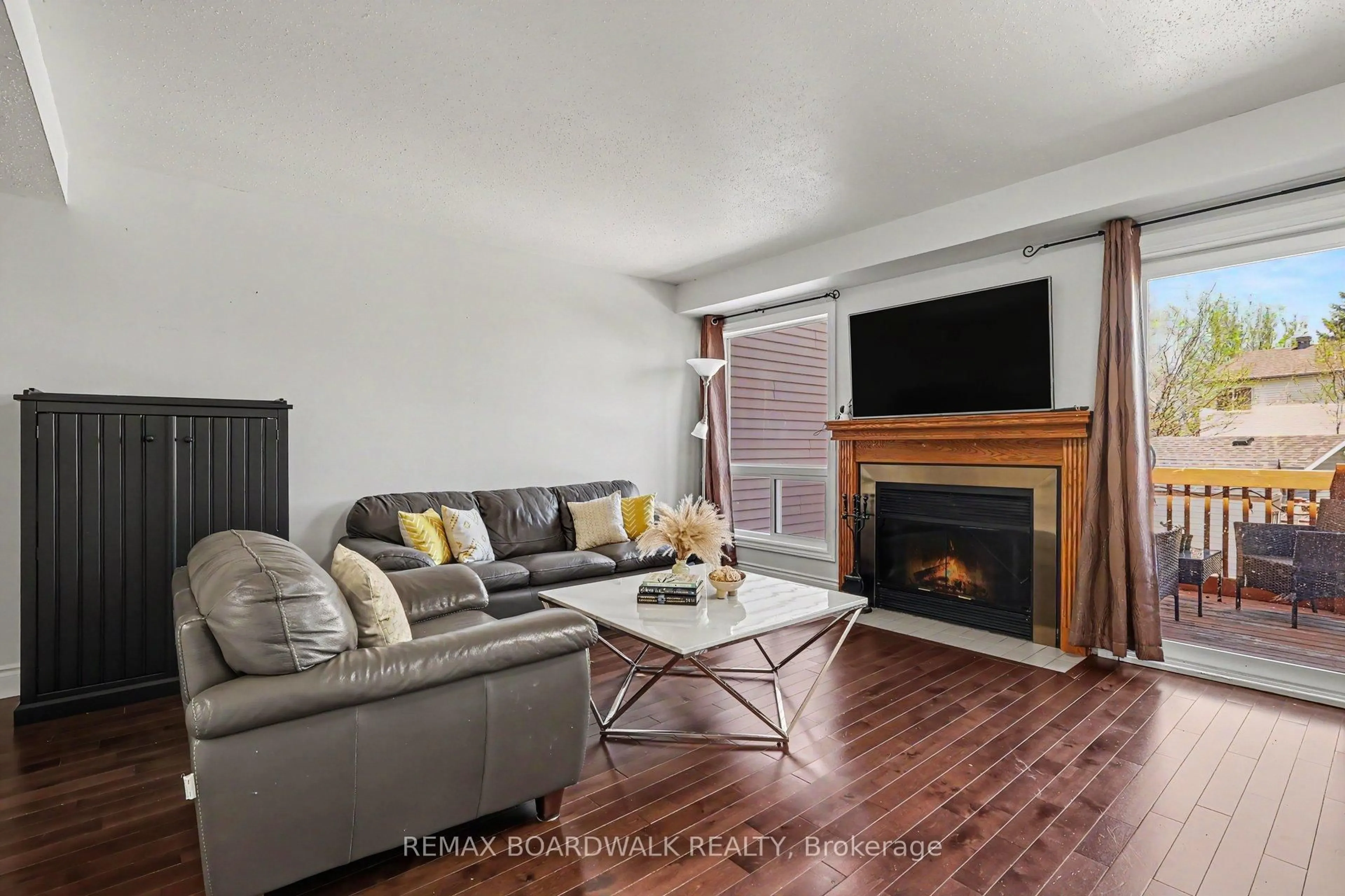Living room with furniture, wood/laminate floor for 1388 Beaucourt Pl, Ottawa Ontario K4A 1W3
