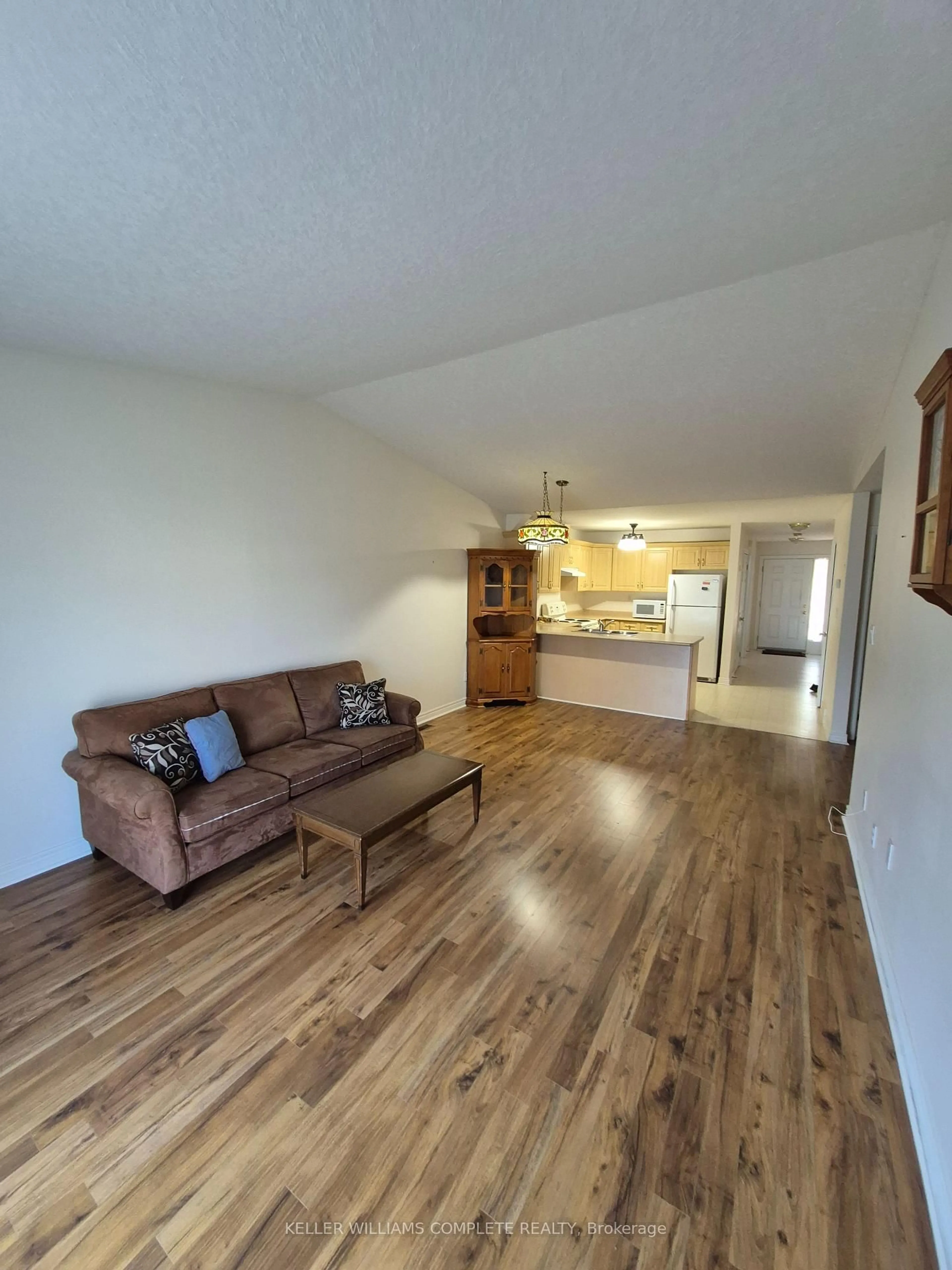 Living room with furniture, wood/laminate floor for 162 FIRST St #10, Welland Ontario L3B 4S2