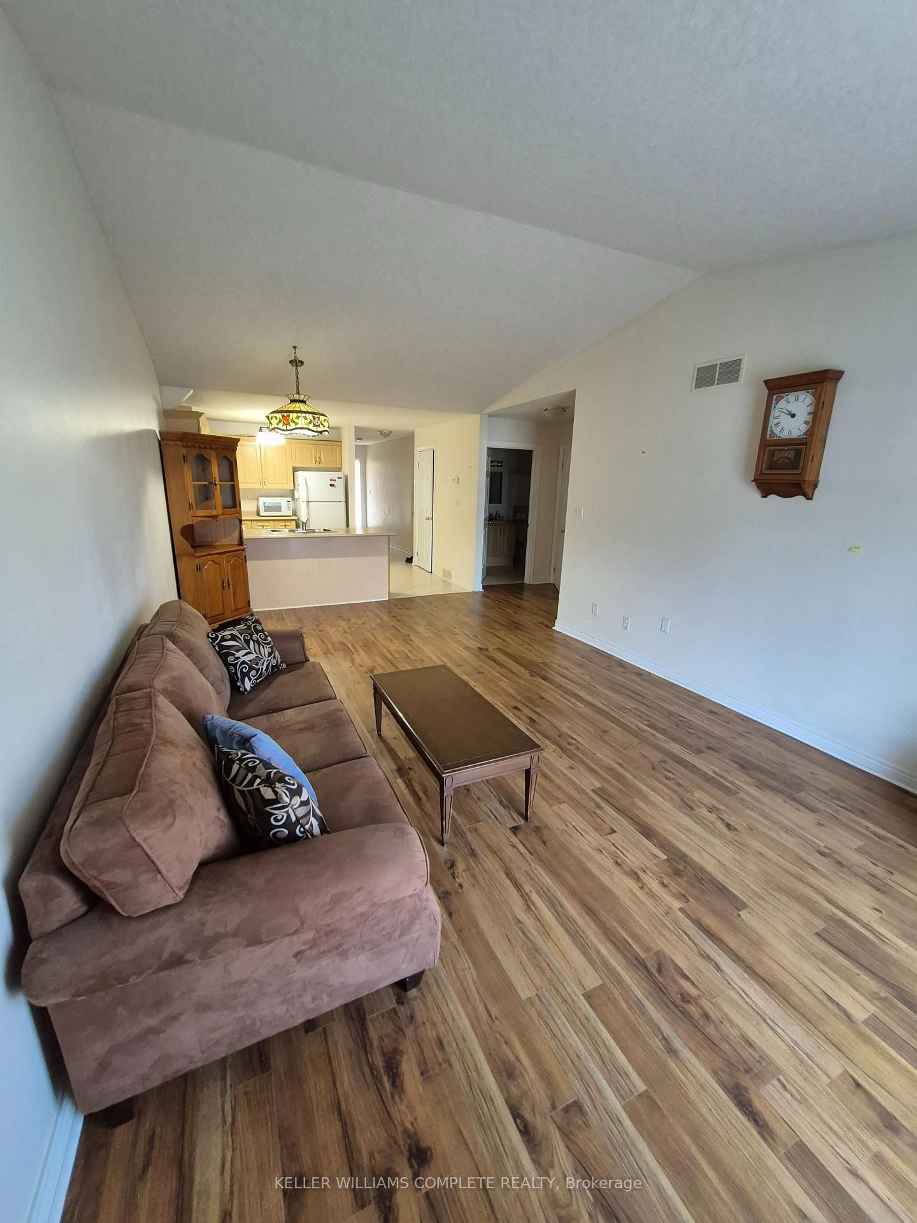 Living room with furniture, wood/laminate floor for 162 FIRST St #10, Welland Ontario L3B 4S2