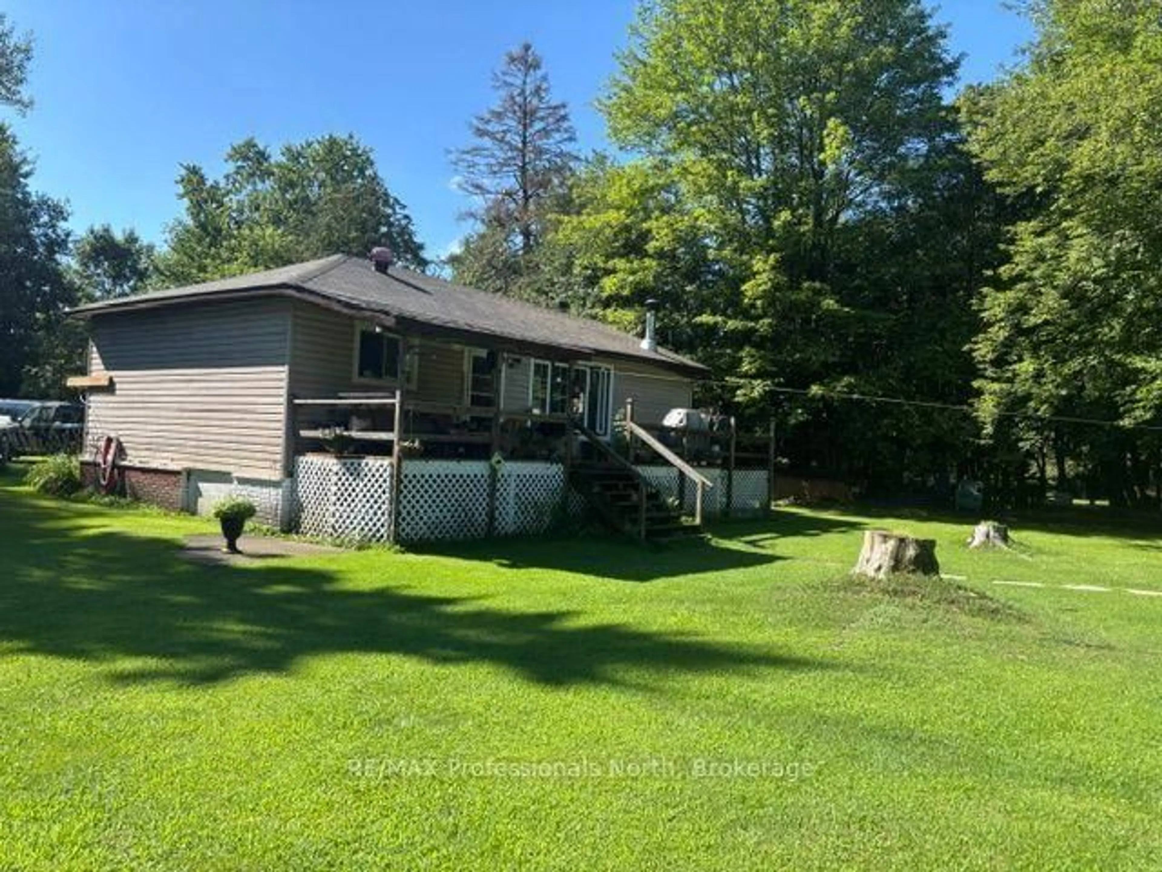 A pic from outside/outdoor area/front of a property/back of a property/a pic from drone, water/lake/river/ocean view for 1436 Spring Valley Rd, Minden Hills Ontario K0M 2K0