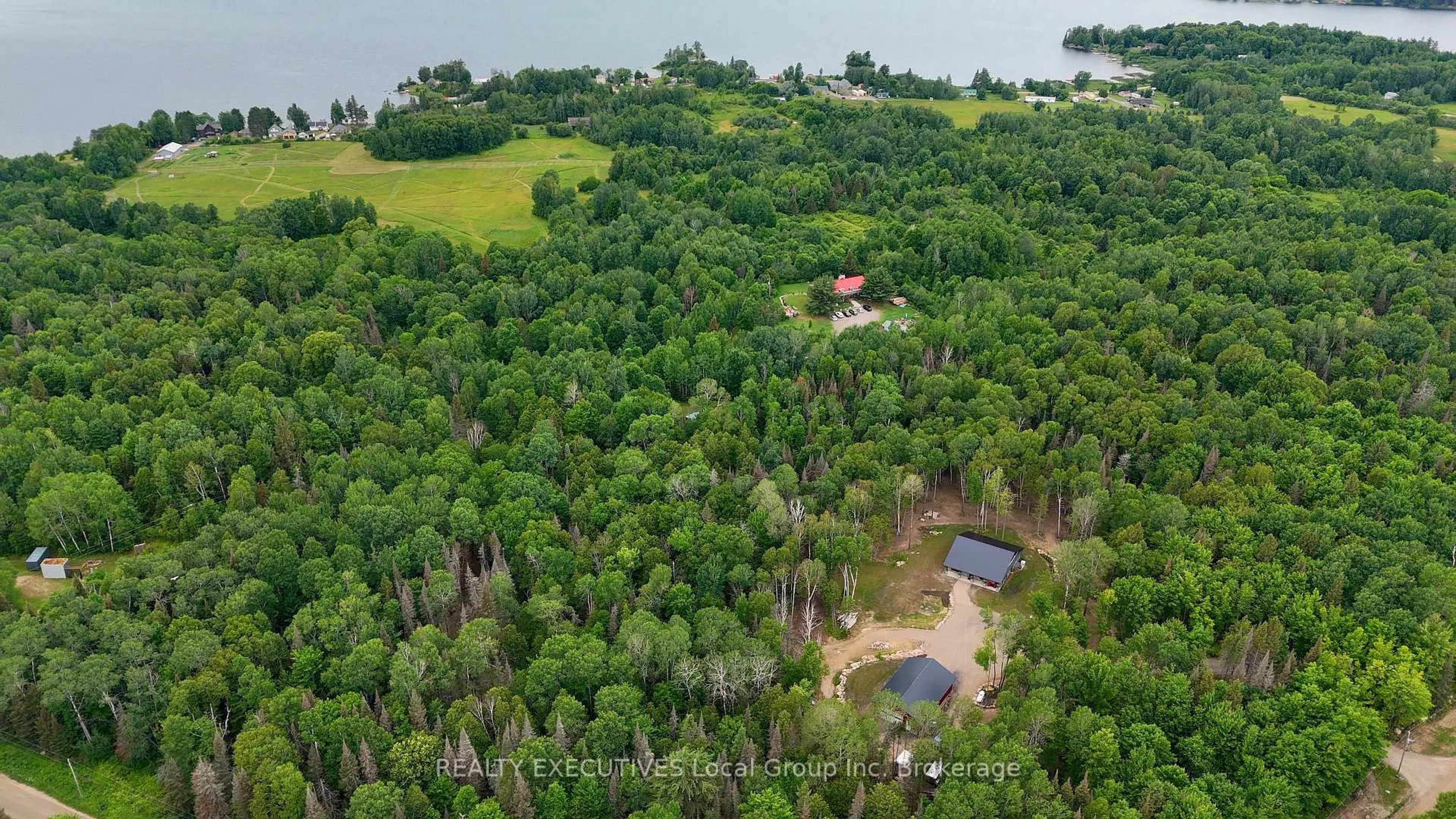 A pic from outside/outdoor area/front of a property/back of a property/a pic from drone, forest/trees view for 2149 SOUTH SHORE Rd, Bonfield Ontario P0H 1E0