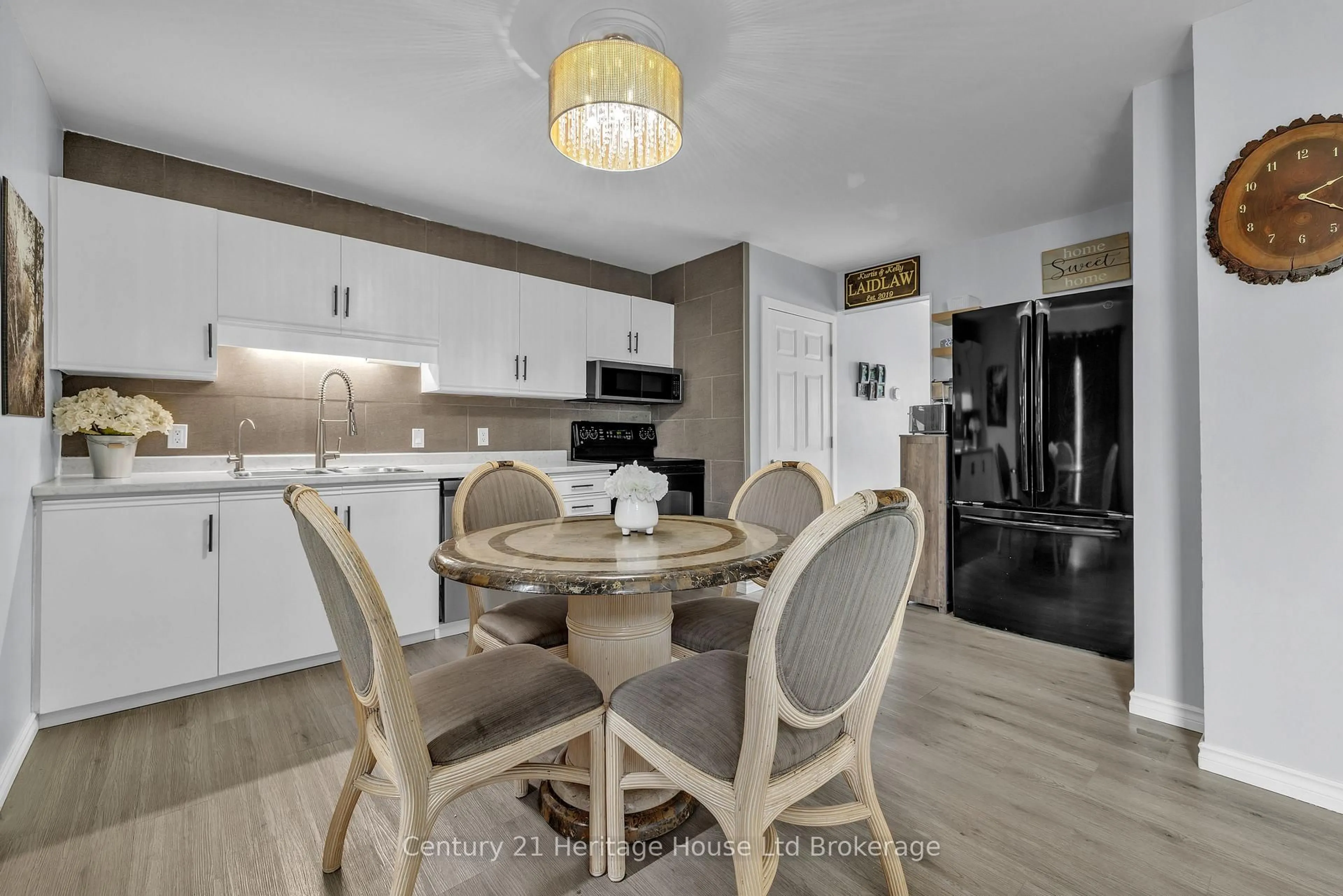 Open concept kitchen, wood/laminate floor for 863 Parkinson Rd #7, Woodstock Ontario N4S 8S7