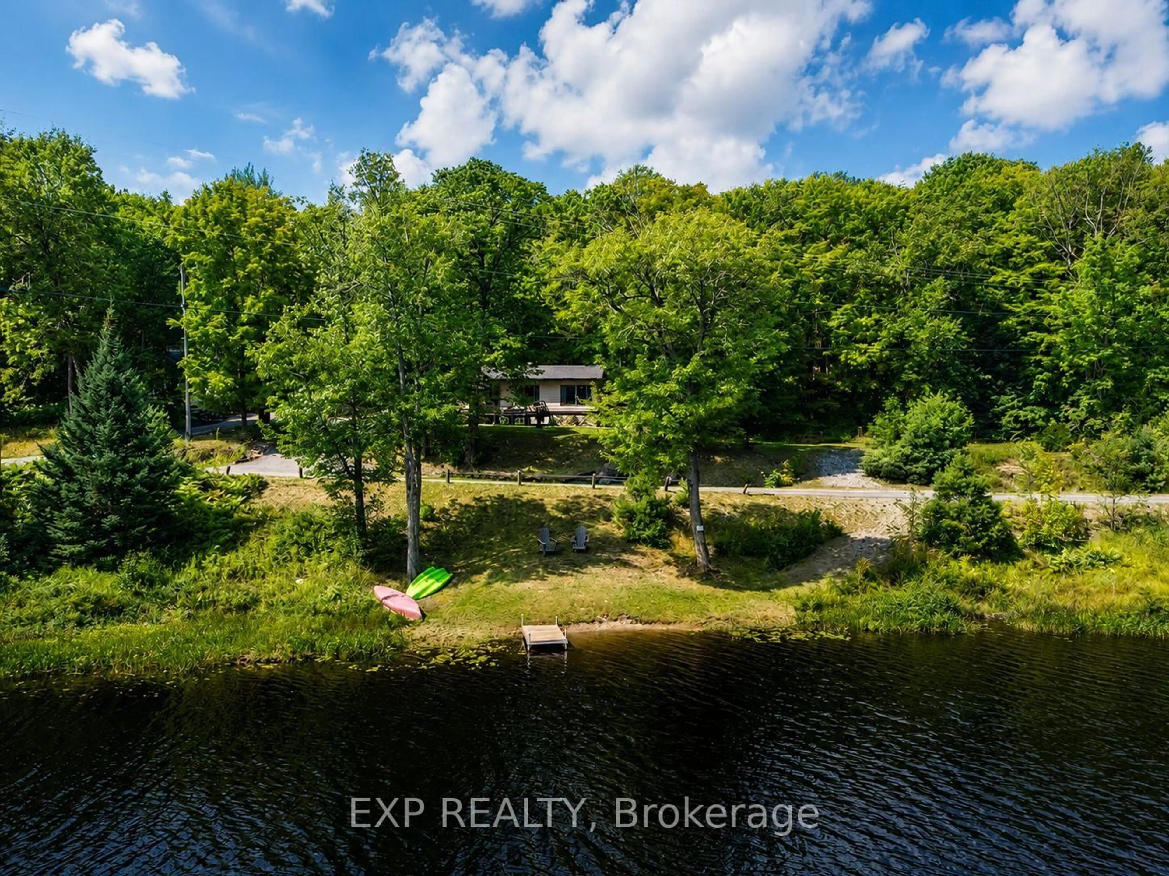A pic from outside/outdoor area/front of a property/back of a property/a pic from drone, water/lake/river/ocean view for 1867 Fraserburg Rd, Bracebridge Ontario P1L 1X3