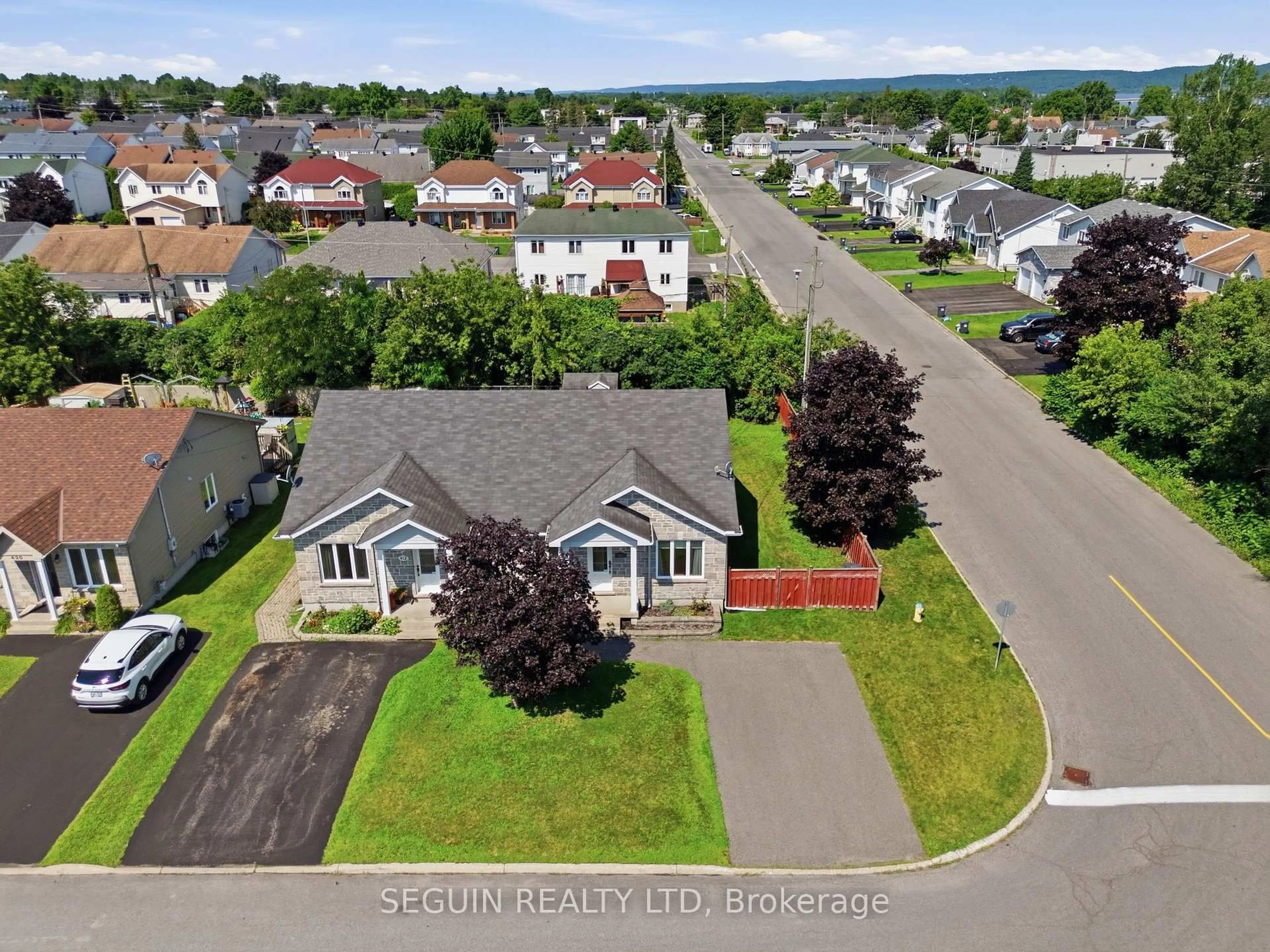 A pic from outside/outdoor area/front of a property/back of a property/a pic from drone, street for 410 Marc Andre St, Hawkesbury Ontario K6A 0A5