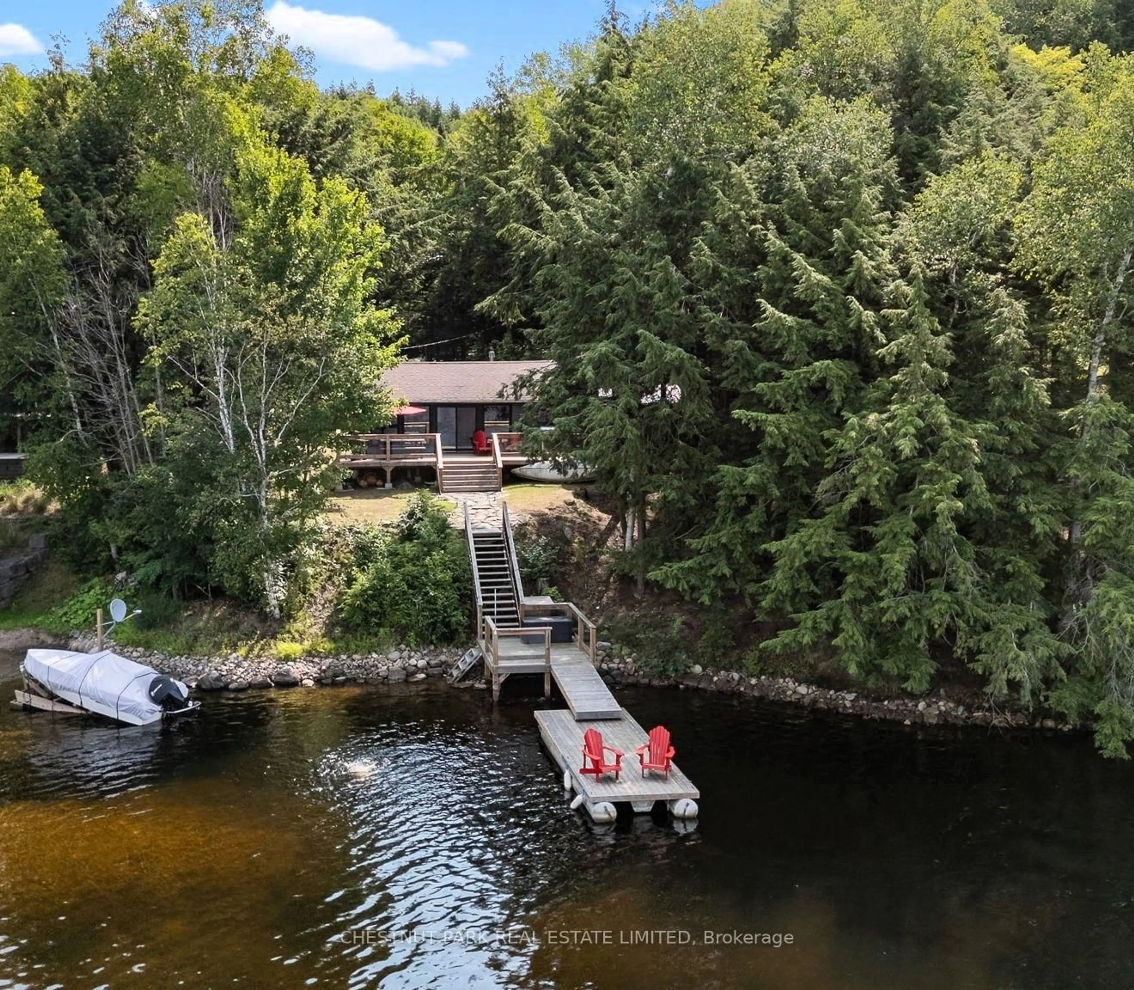 A pic from outside/outdoor area/front of a property/back of a property/a pic from drone, water/lake/river/ocean view for 1004 Aztec Tr, Dysart et al Ontario K0M 1S0