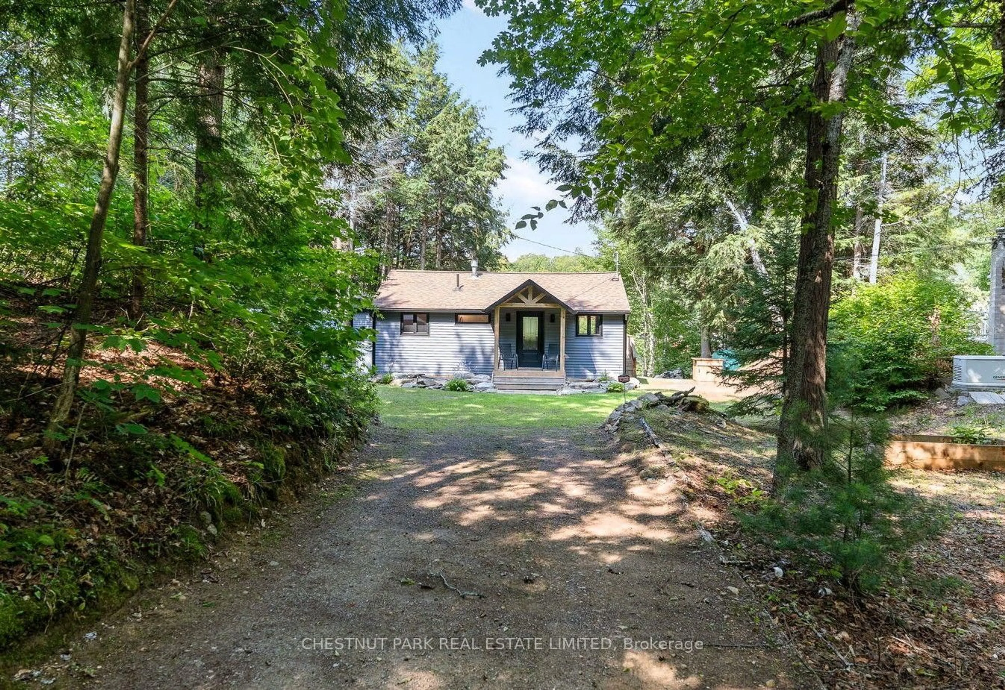 A pic from outside/outdoor area/front of a property/back of a property/a pic from drone, forest/trees view for 1004 Aztec Tr, Dysart et al Ontario K0M 1S0
