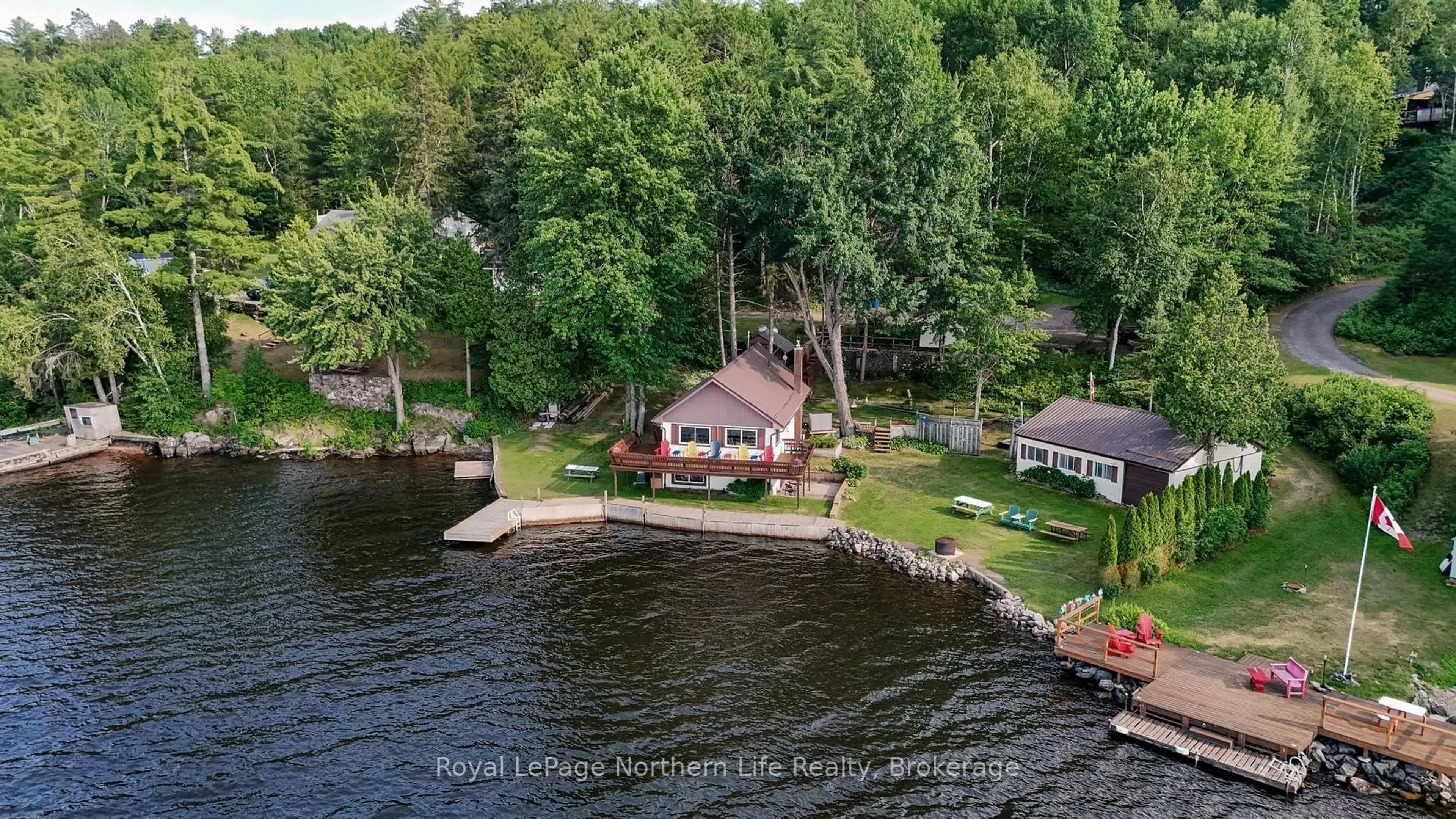 A pic from outside/outdoor area/front of a property/back of a property/a pic from drone, water/lake/river/ocean view for 216 Green Rd, Callander Ontario P0H 1H0