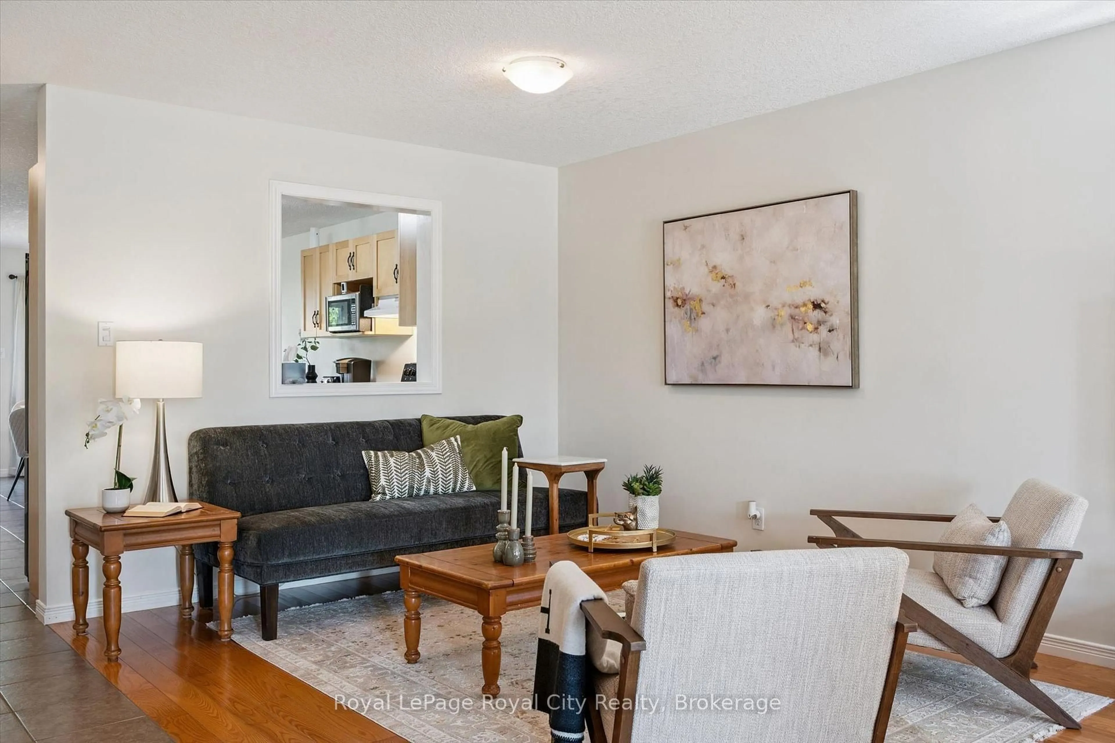 Living room with furniture, wood/laminate floor for 105 Spencer Dr, Centre Wellington Ontario N0B 1S0