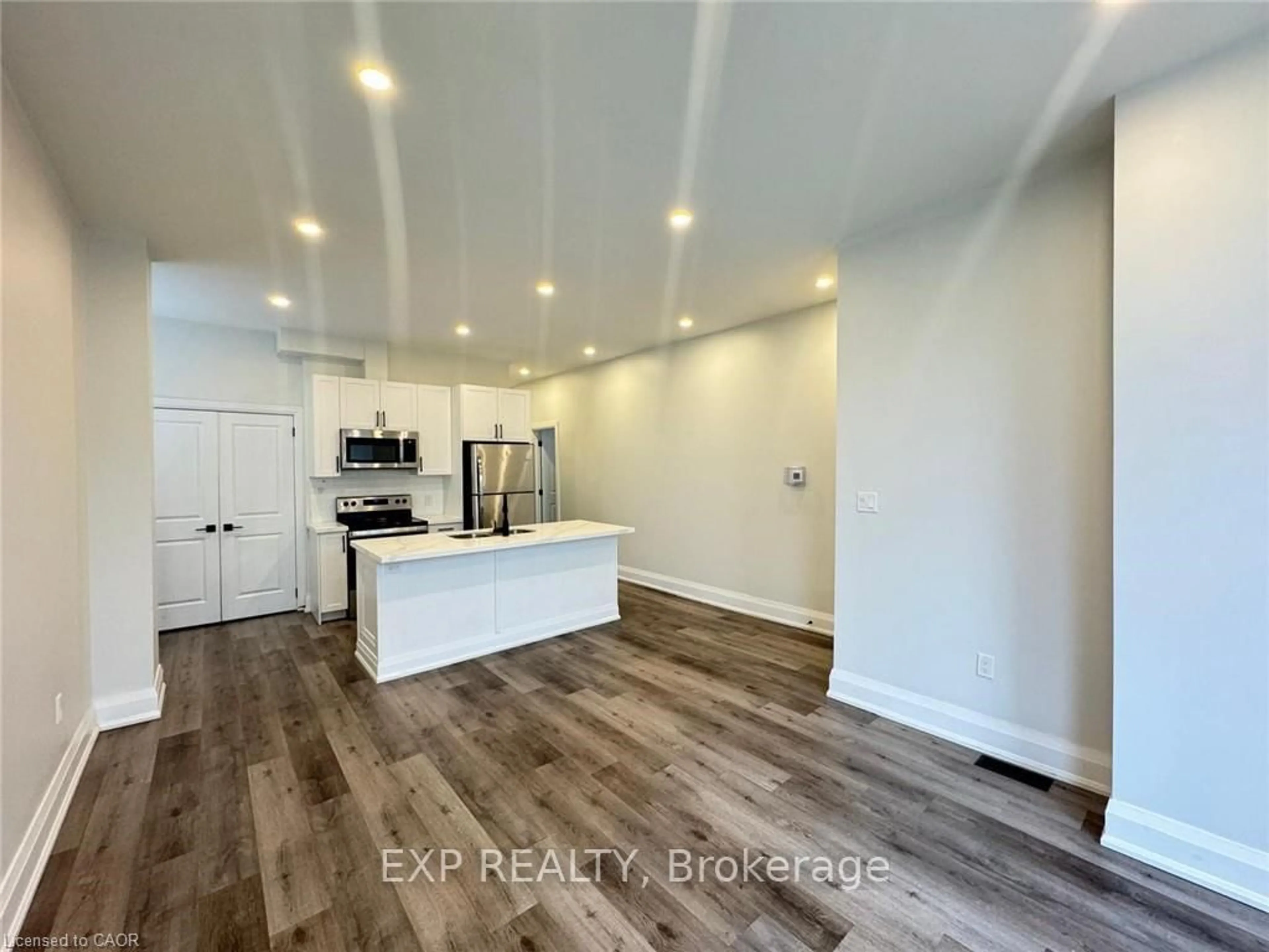 Open concept kitchen, wood/laminate floor for 507 Wilson St, Hamilton Ontario L8L 1T4