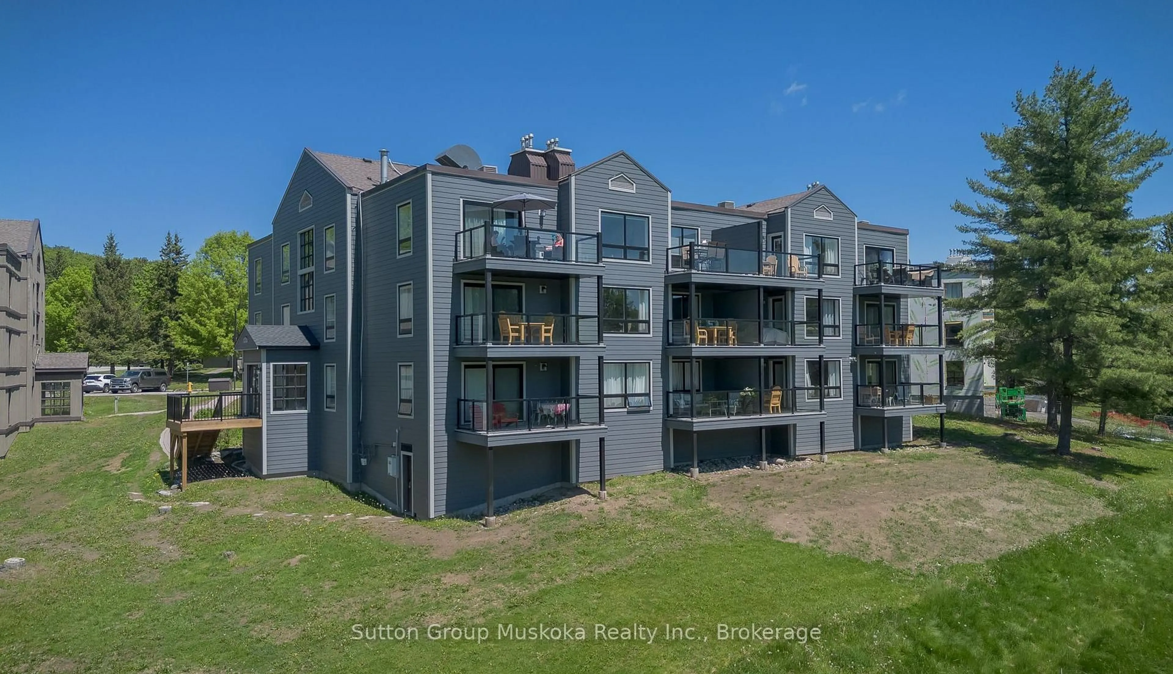 A pic from outside/outdoor area/front of a property/back of a property/a pic from drone, building for 54-305 Deerhurst, Summit Lodge Dr #54, Huntsville Ontario P1H 2E8