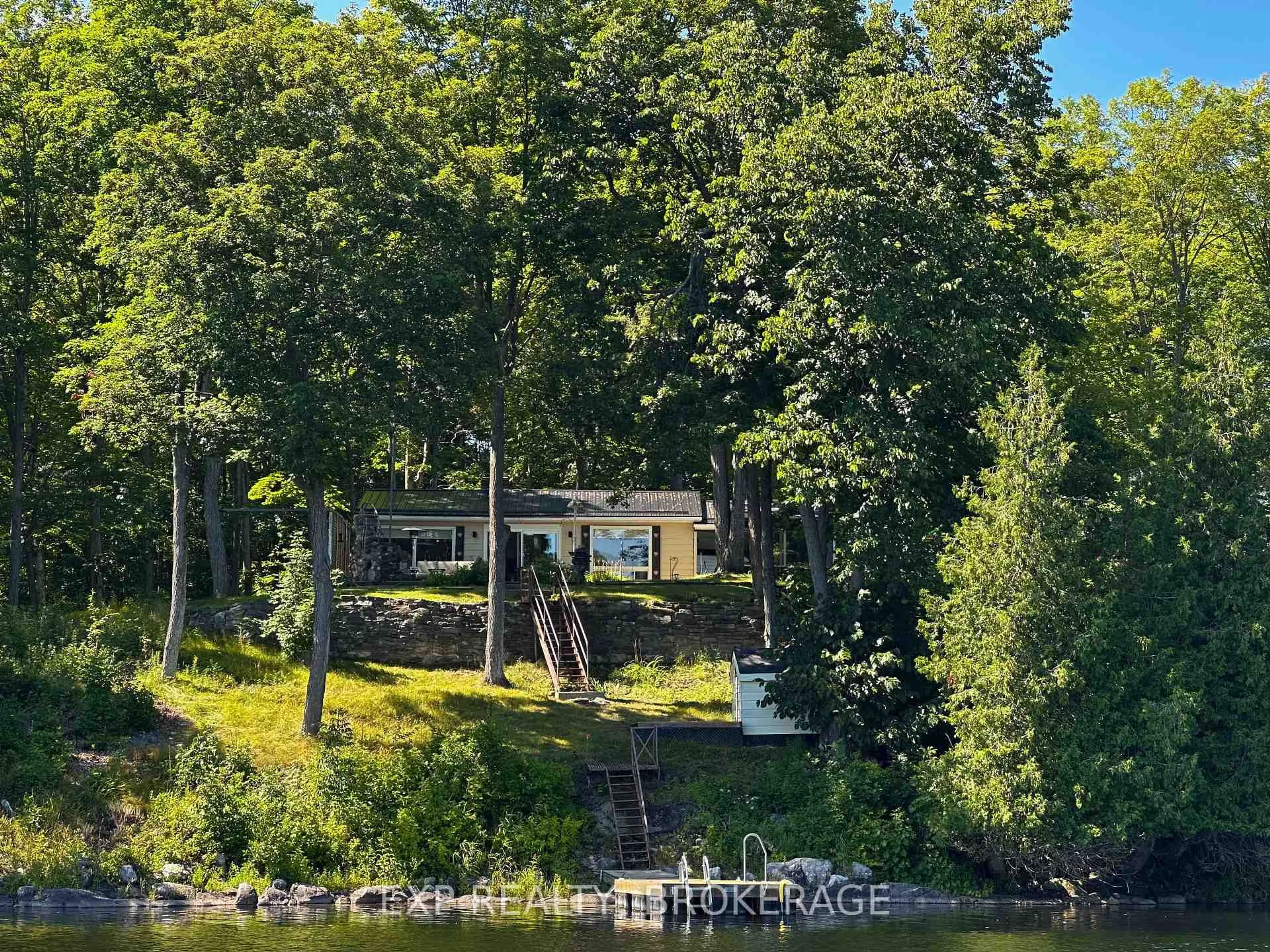 A pic from outside/outdoor area/front of a property/back of a property/a pic from drone, water/lake/river/ocean view for 2107 Hambly Lane, Hartington Ontario K0H 1W0