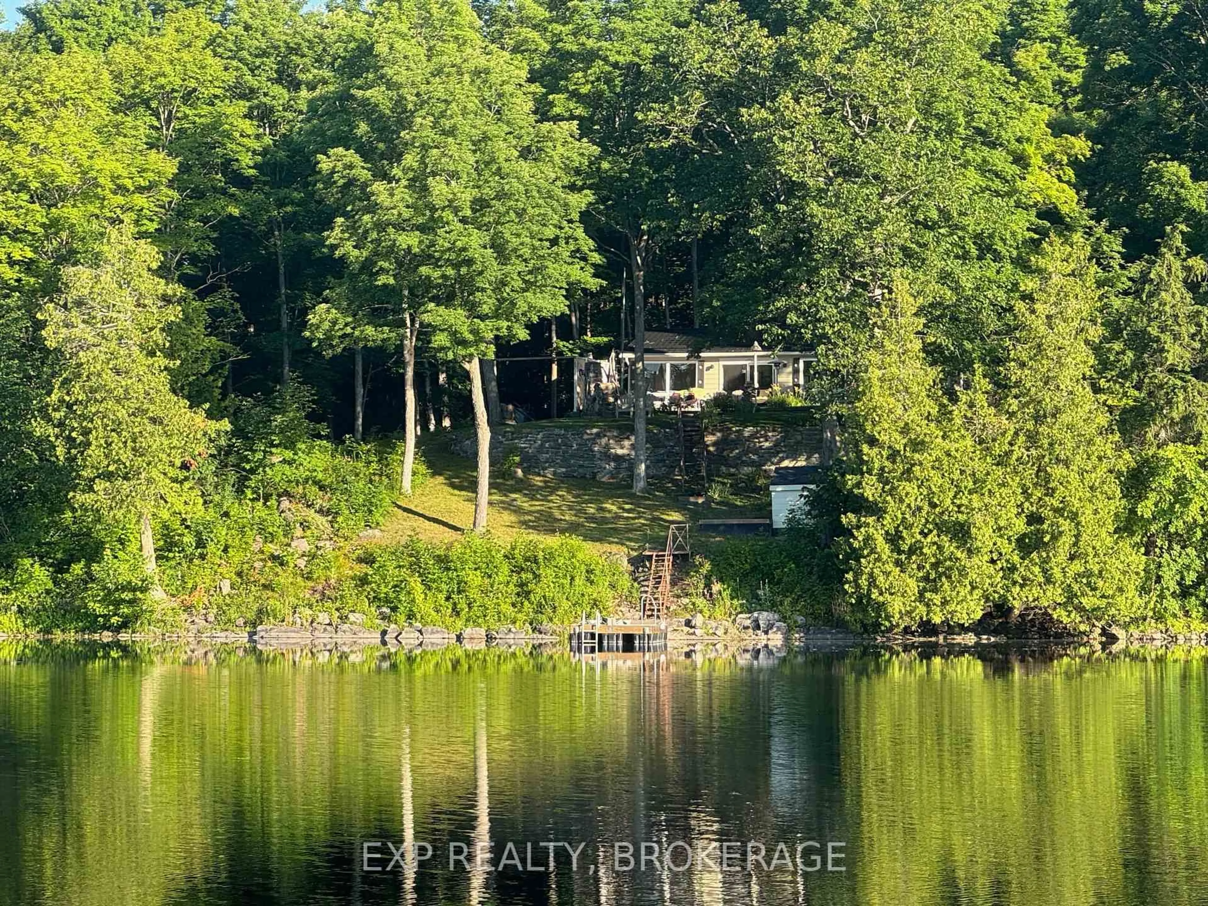 A pic from outside/outdoor area/front of a property/back of a property/a pic from drone, water/lake/river/ocean view for 2107 Hambly Lane, Hartington Ontario K0H 1W0