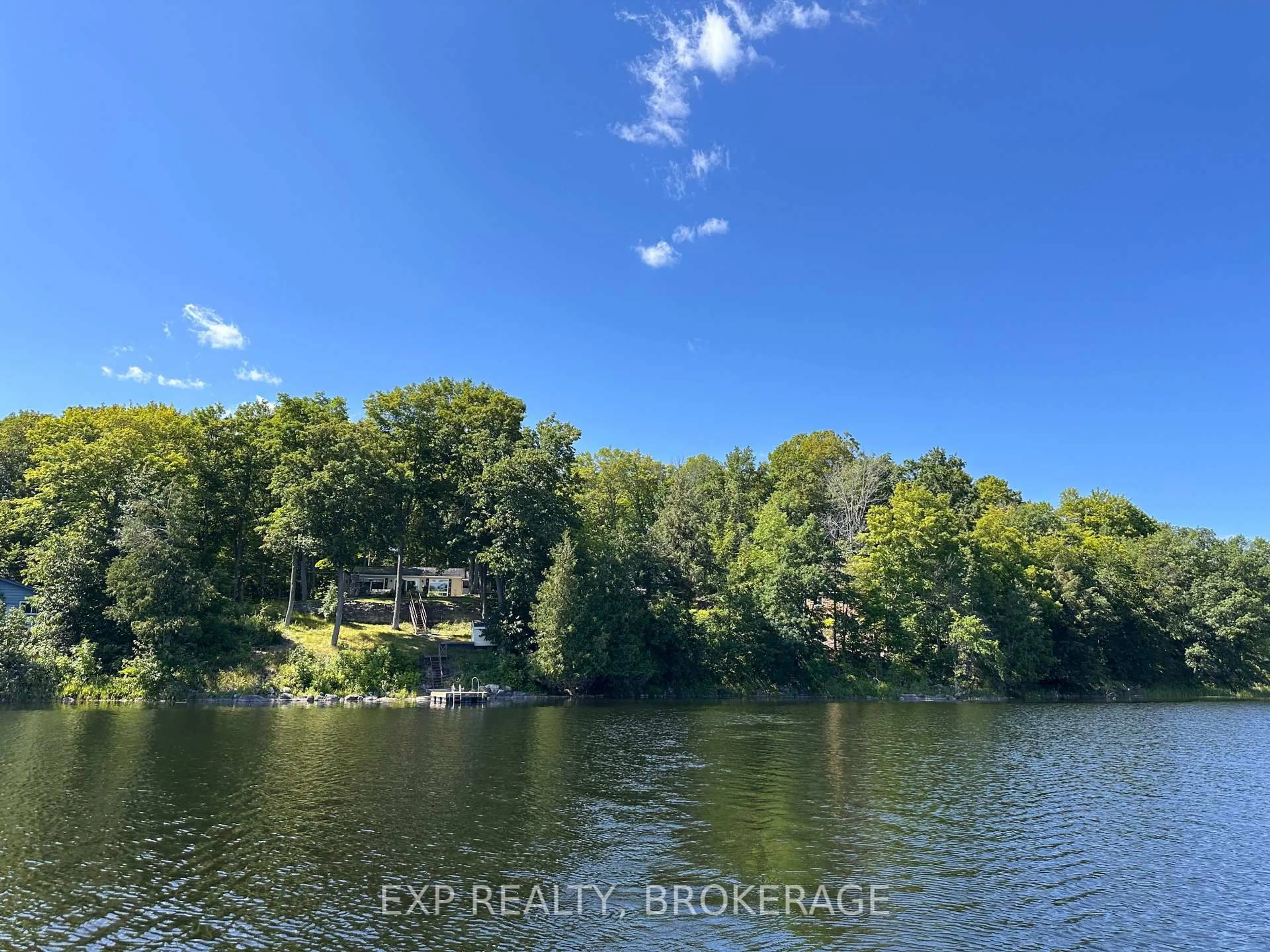A pic from outside/outdoor area/front of a property/back of a property/a pic from drone, water/lake/river/ocean view for 2107 Hambly Lane, Hartington Ontario K0H 1W0