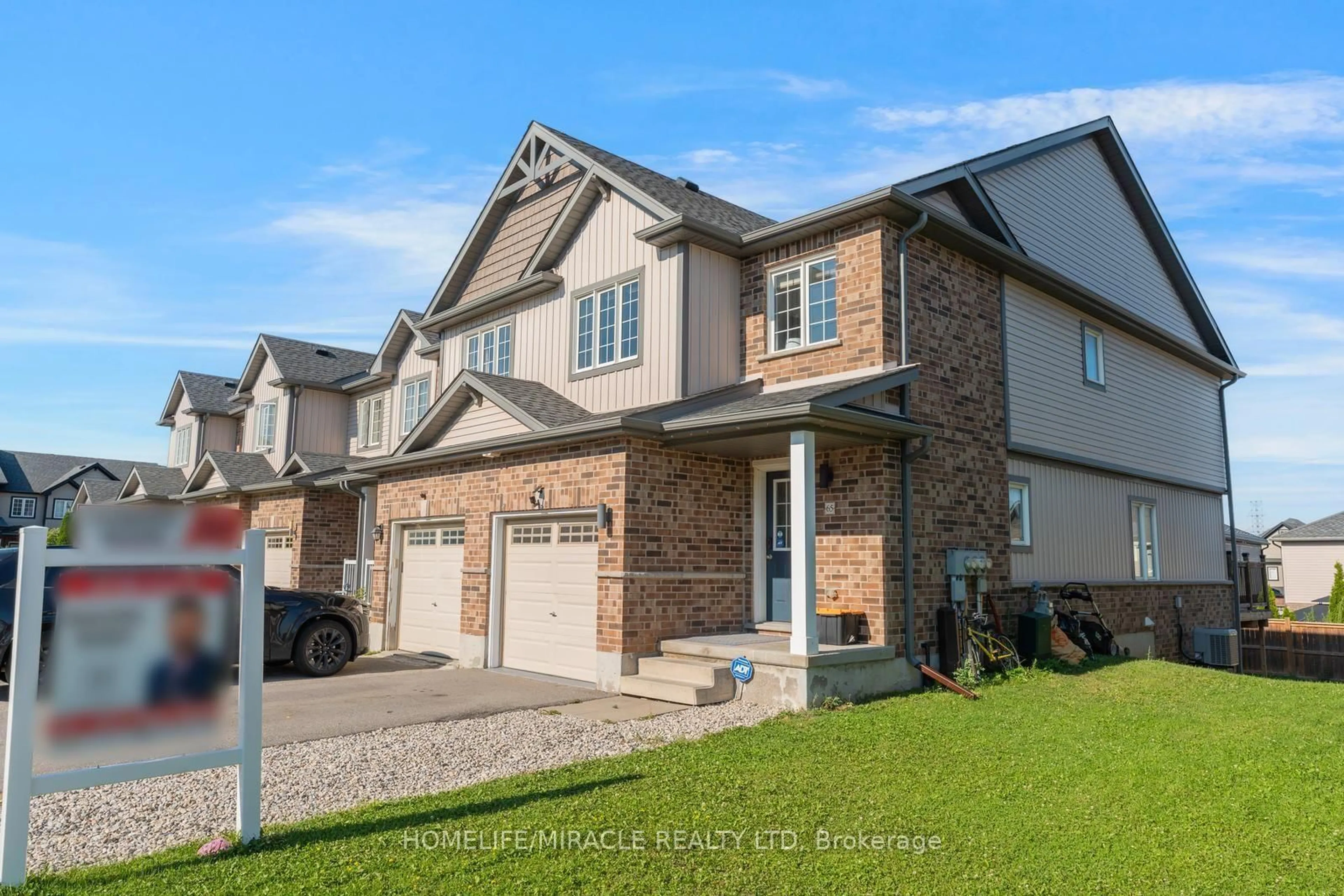 Home with brick exterior material, street for 65 Renfrew St, Kitchener Ontario N2R 0G5