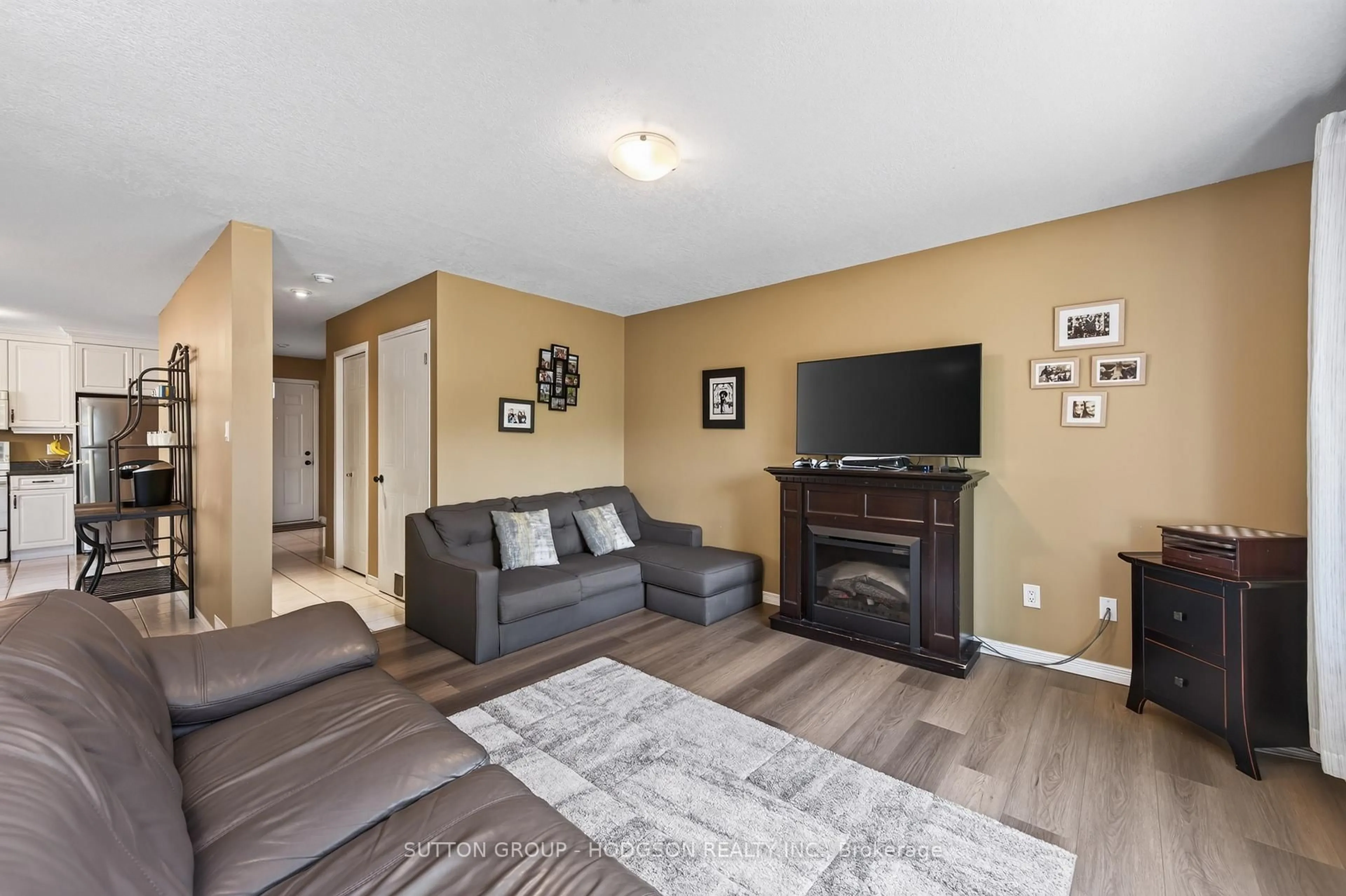 Living room with furniture, wood/laminate floor for 171 Emerald Rd, London South Ontario N6M 1J3