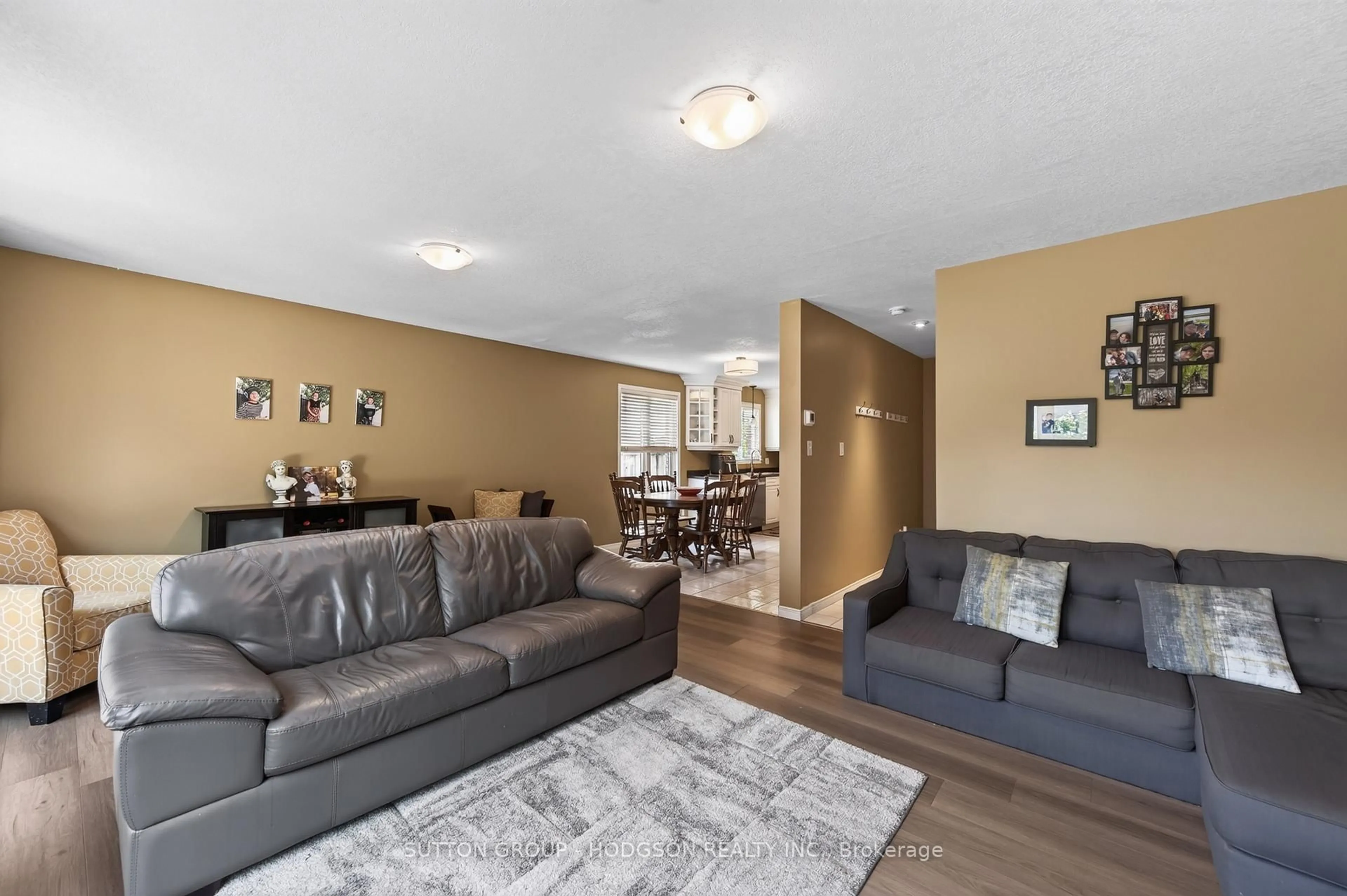 Living room with furniture, wood/laminate floor for 171 Emerald Rd, London South Ontario N6M 1J3