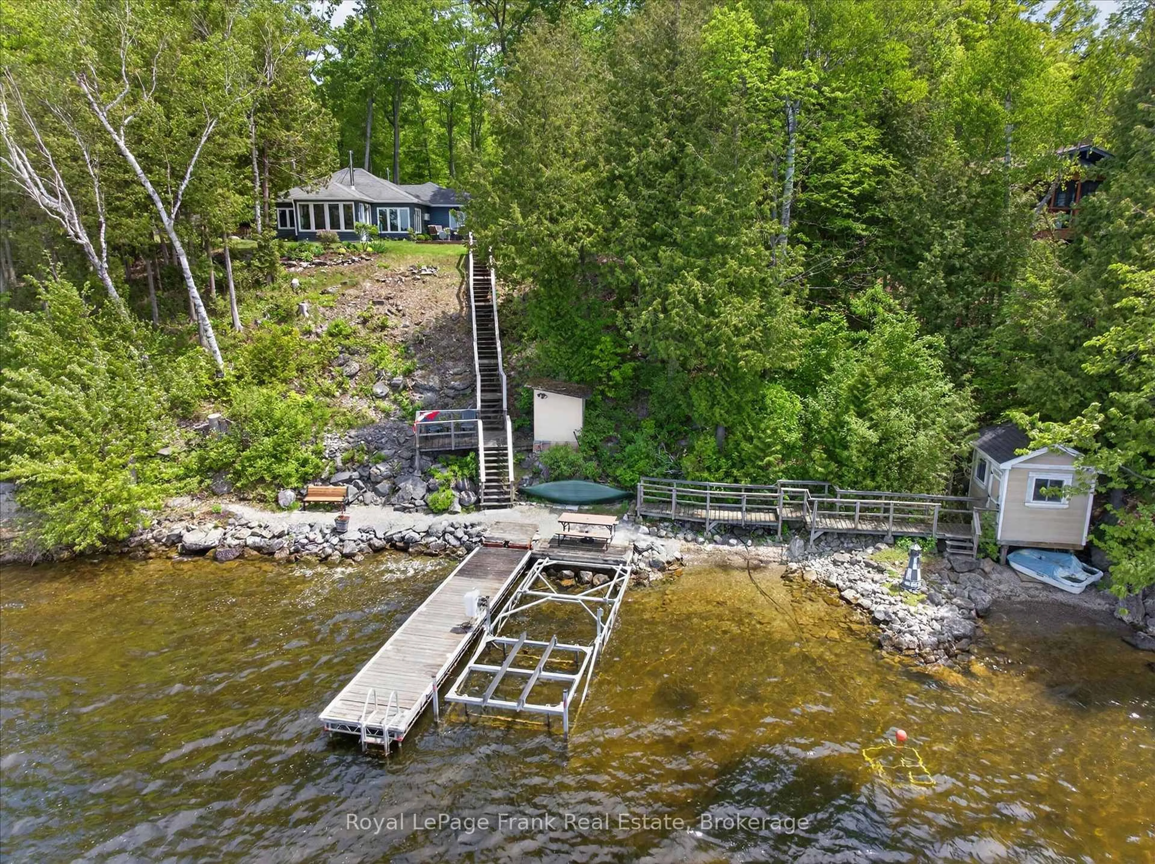 A pic from outside/outdoor area/front of a property/back of a property/a pic from drone, water/lake/river/ocean view for 944 Birchcliff Dr, Douro-Dummer Ontario K0L 2H0