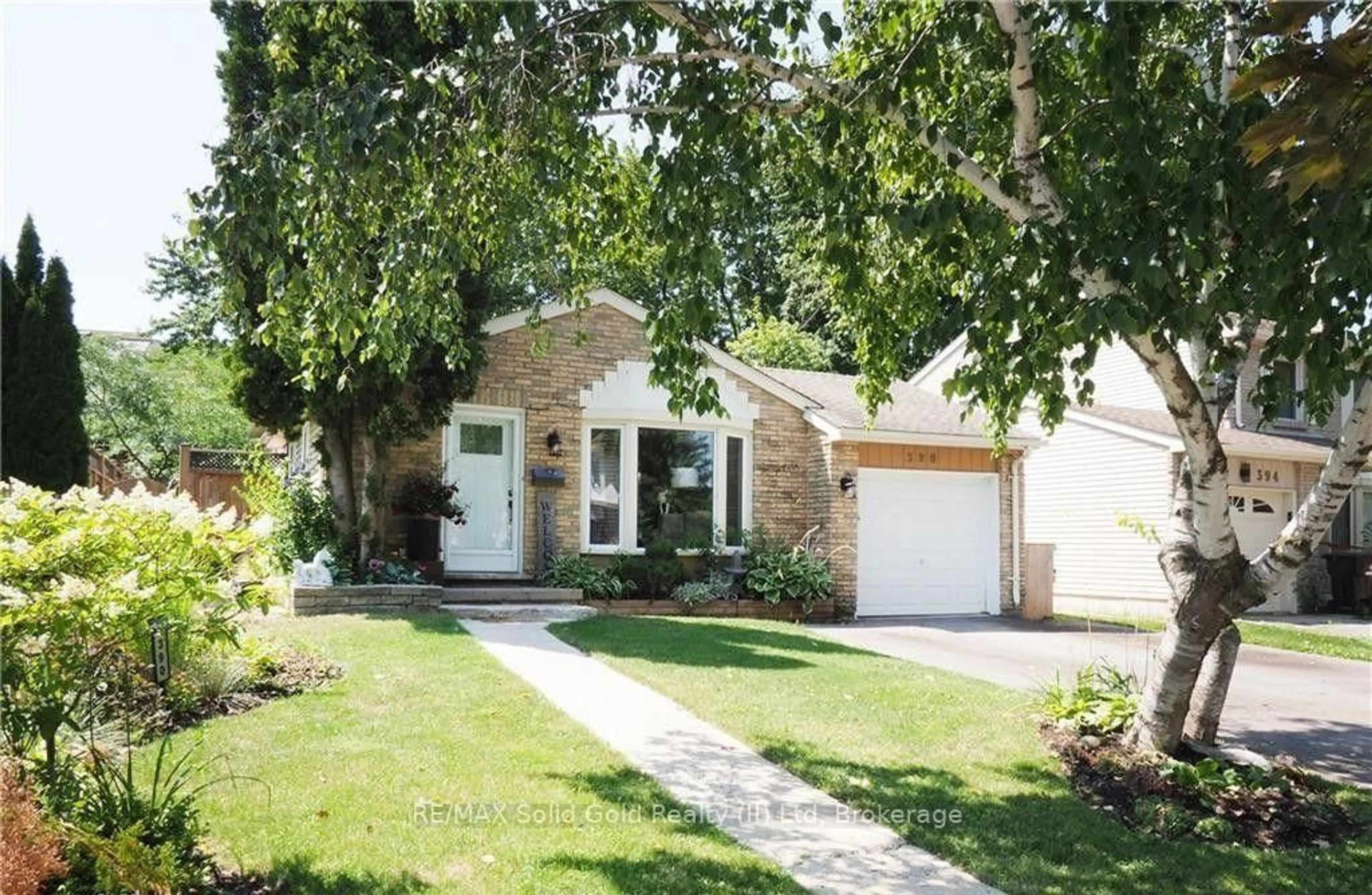 Home with brick exterior material, street for 390 Driftwood Dr, Kitchener Ontario N2N 1Y6