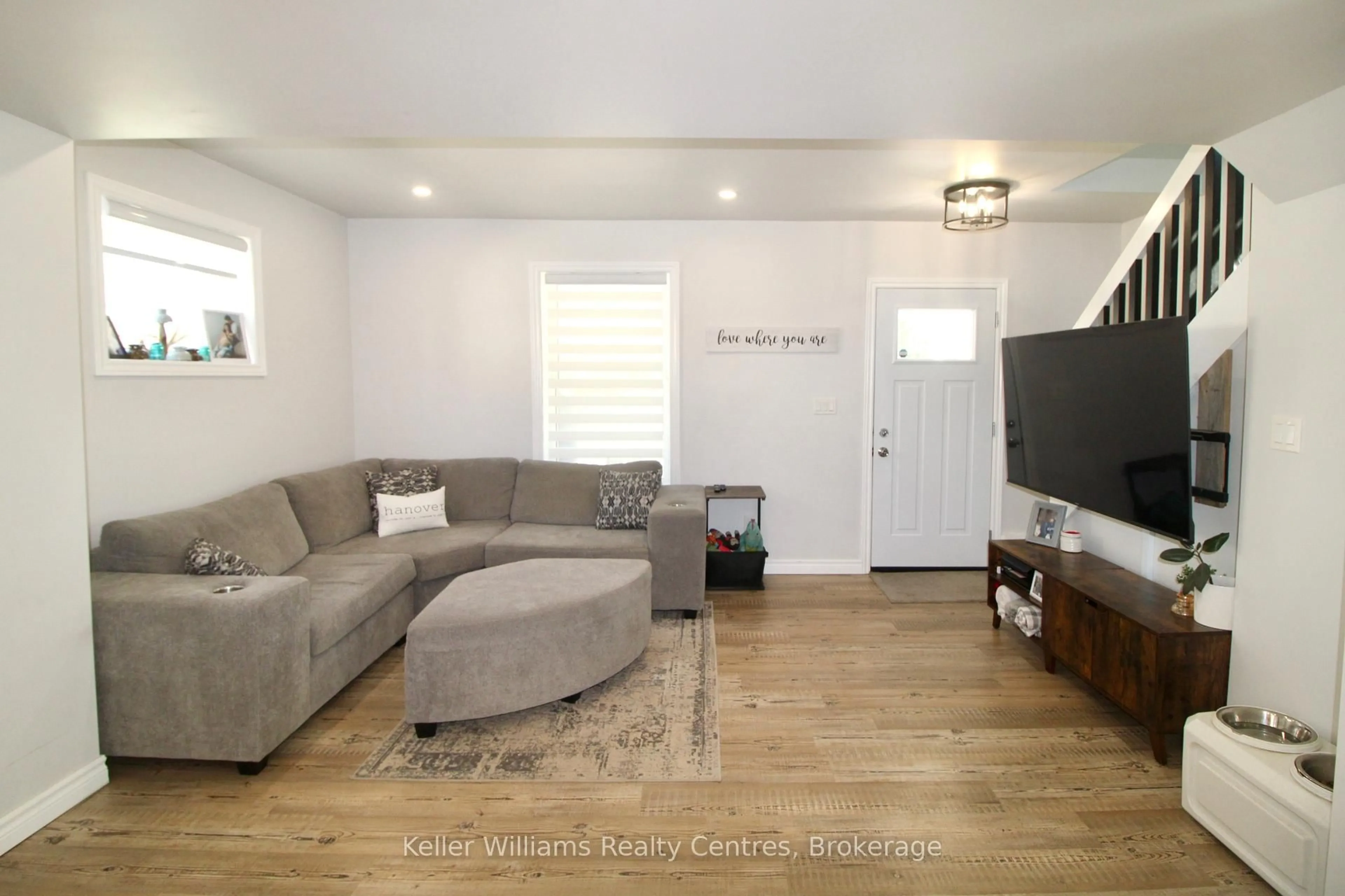 Living room with furniture, wood/laminate floor for 445 11TH St, Hanover Ontario N4N 1S8