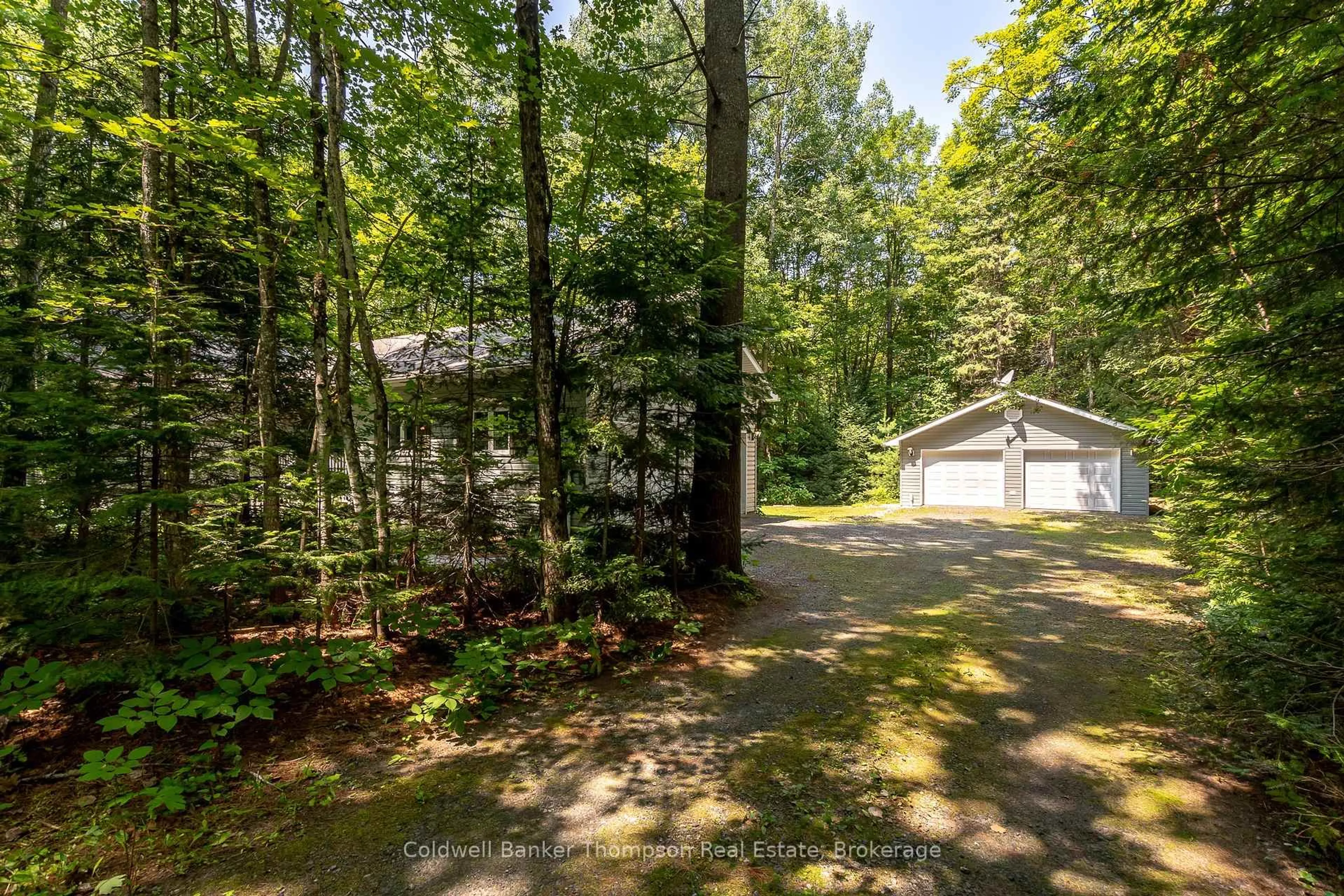 A pic from outside/outdoor area/front of a property/back of a property/a pic from drone, forest/trees view for 592 White House Rd, Huntsville Ontario P1H 2J3
