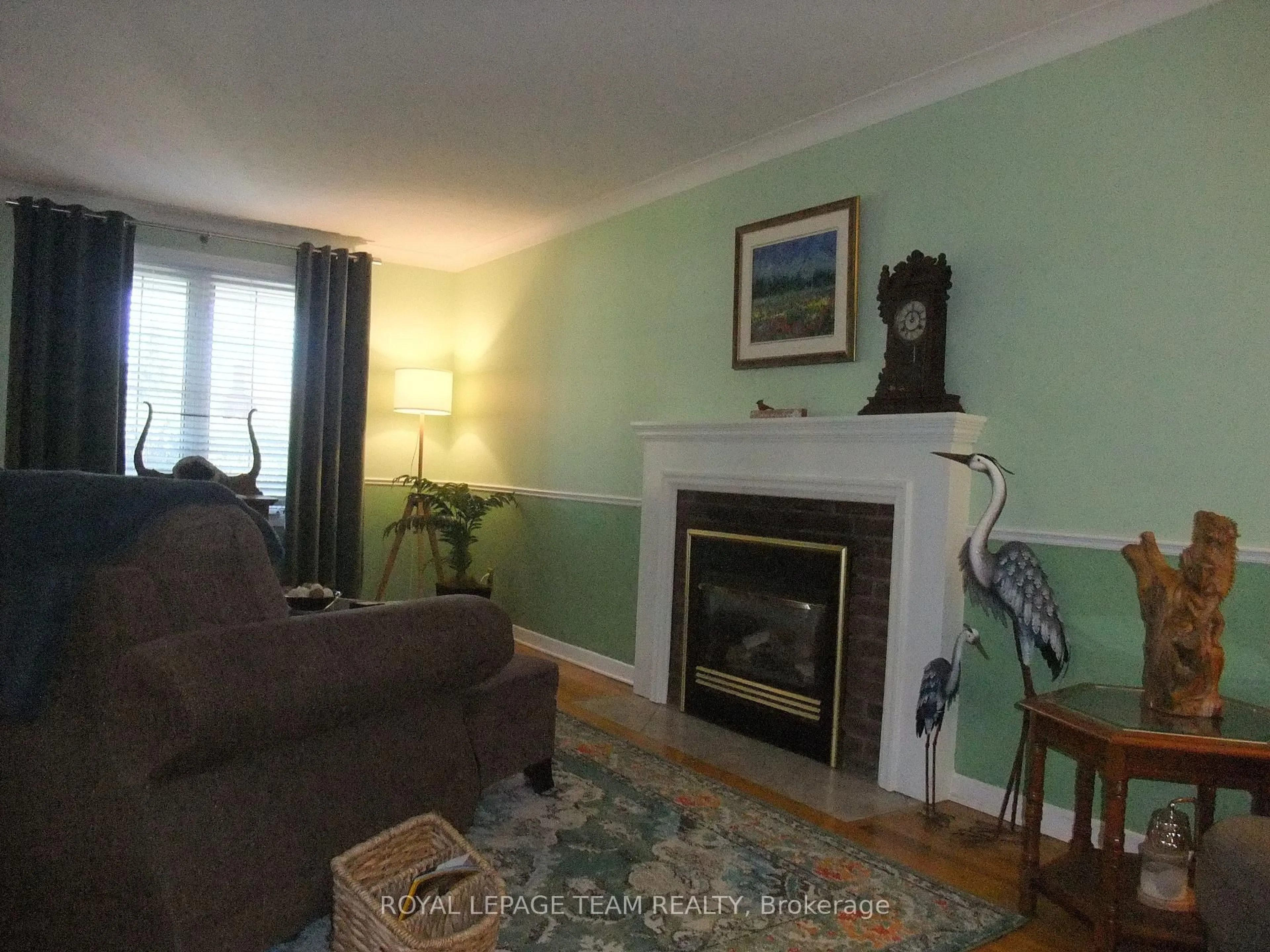 Living room with furniture, wood/laminate floor for 32 Gary Cres, Arnprior Ontario K7S 2R3