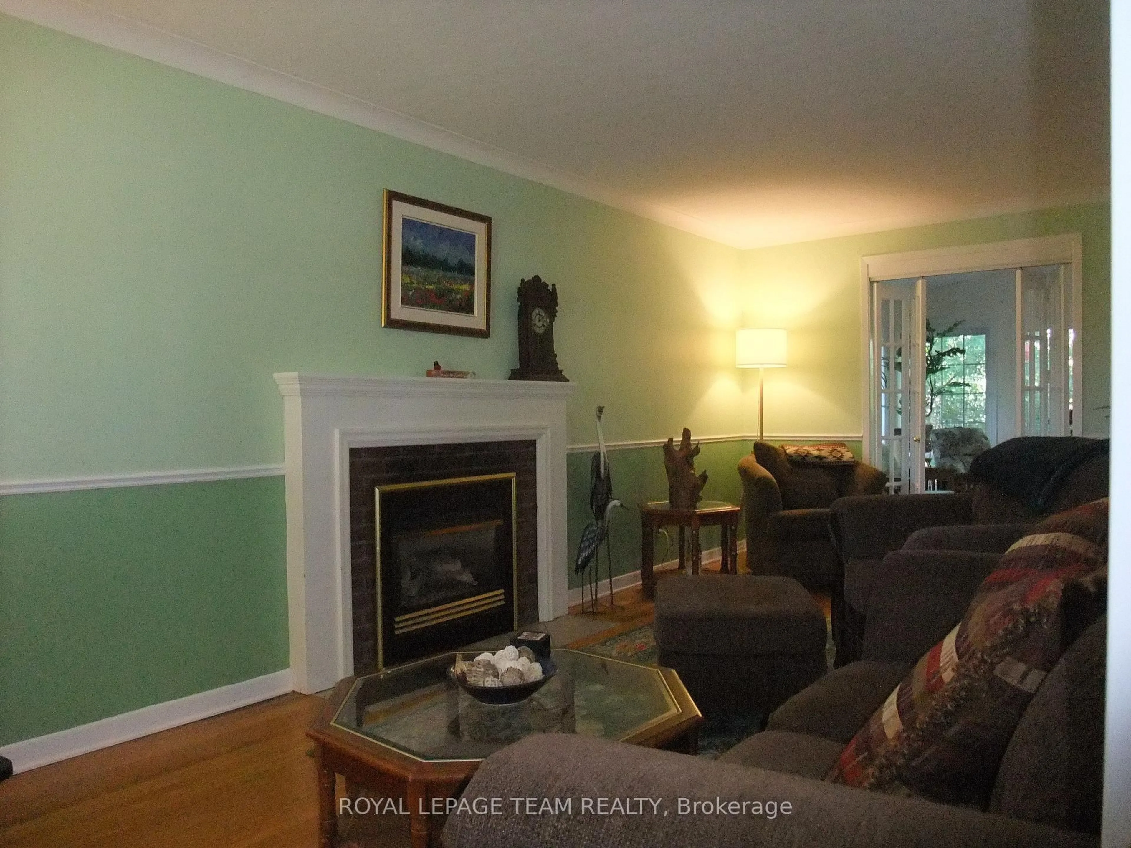 Living room with furniture, wood/laminate floor for 32 Gary Cres, Arnprior Ontario K7S 2R3