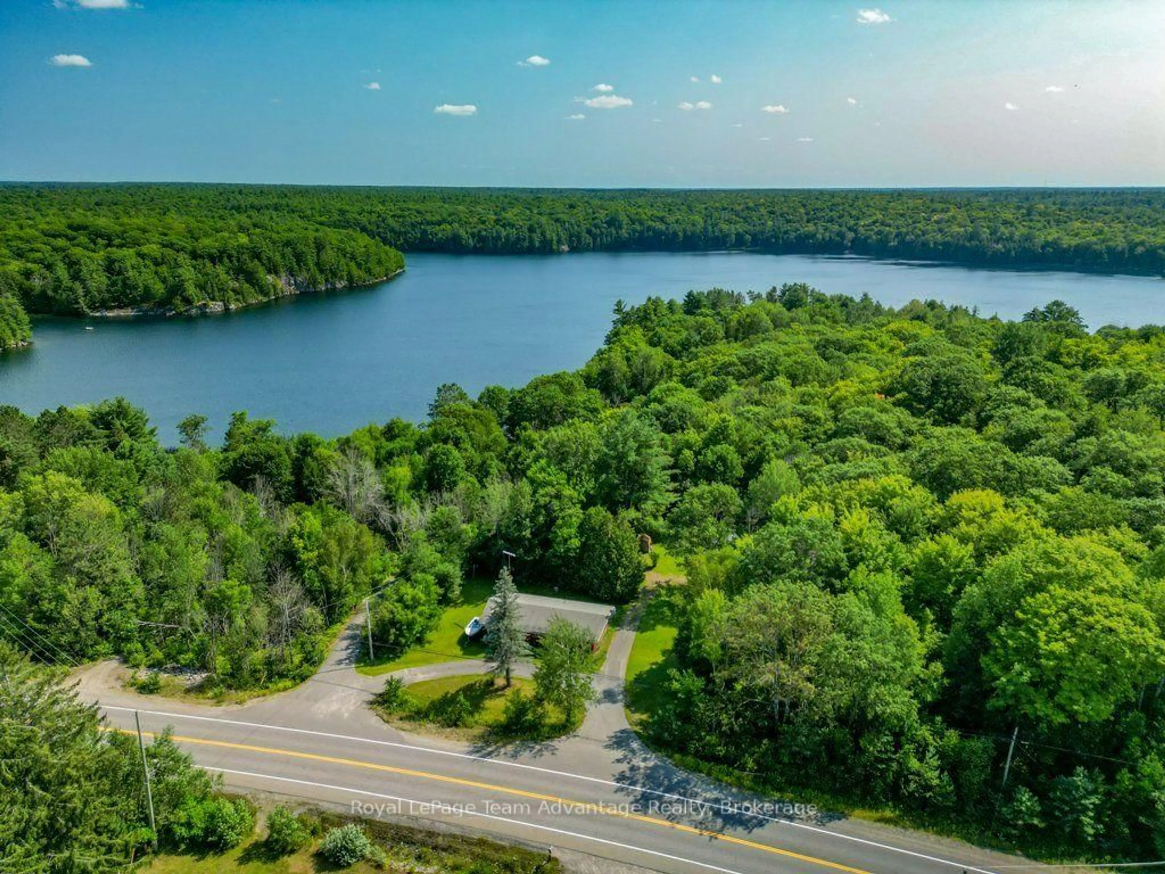 A pic from outside/outdoor area/front of a property/back of a property/a pic from drone, water/lake/river/ocean view for 584 A & B Hwy 141, Seguin Ontario P0C 1J0