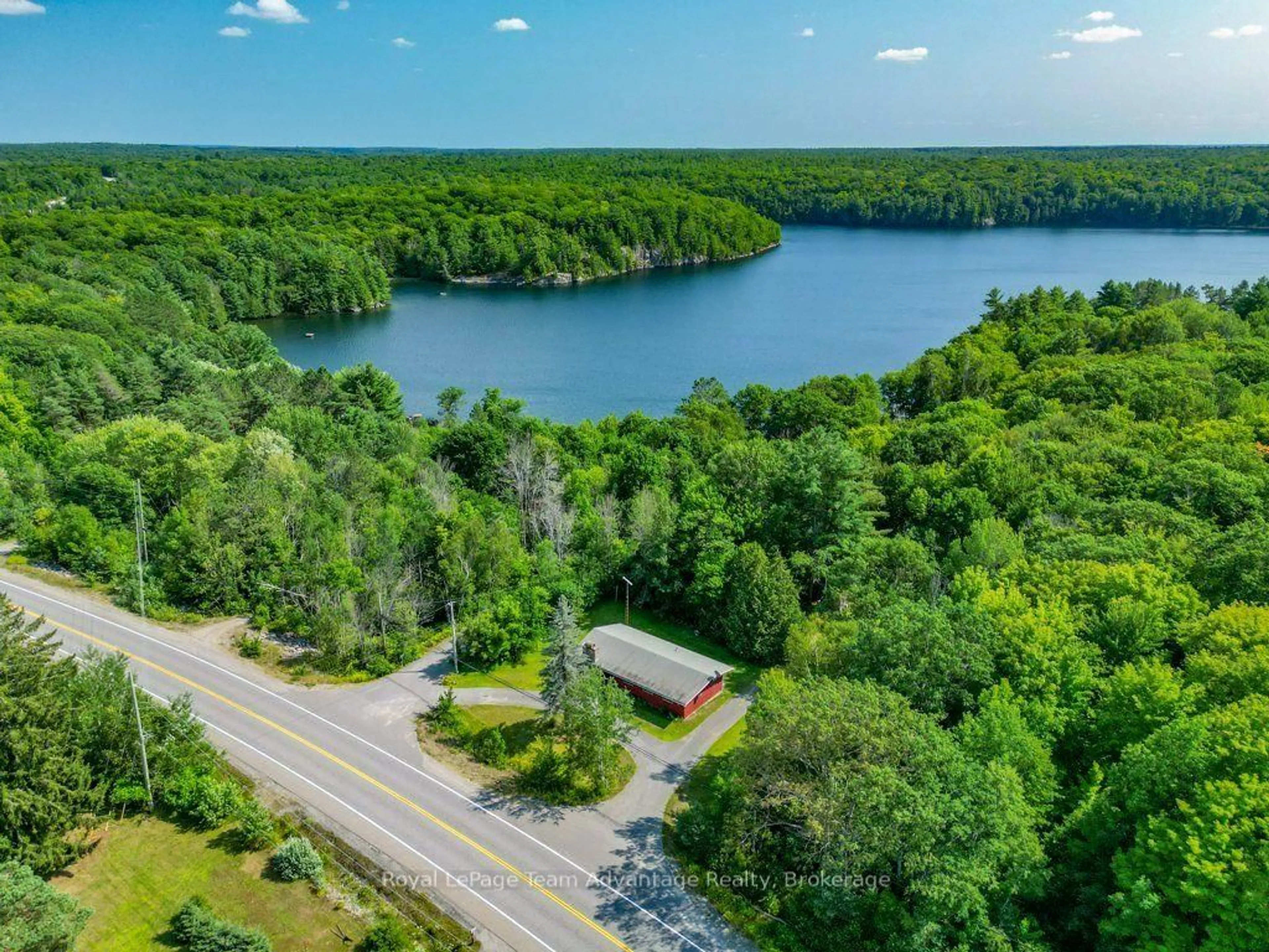 A pic from outside/outdoor area/front of a property/back of a property/a pic from drone, water/lake/river/ocean view for 584 A & B Hwy 141, Seguin Ontario P0C 1J0