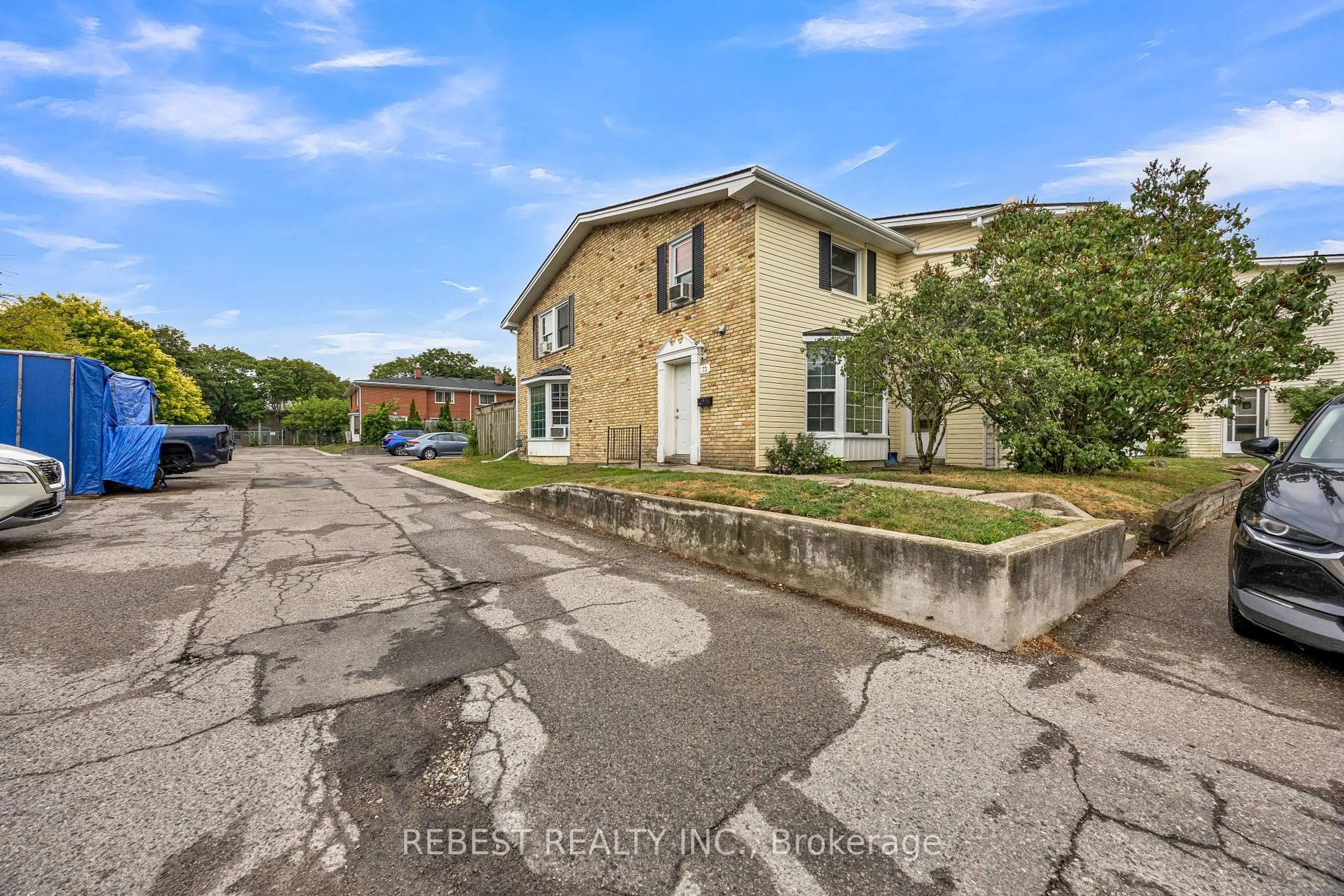 A pic from outside/outdoor area/front of a property/back of a property/a pic from drone, street for 73 Arbour Glen Cres #1, London East Ontario N5Y 1Z9