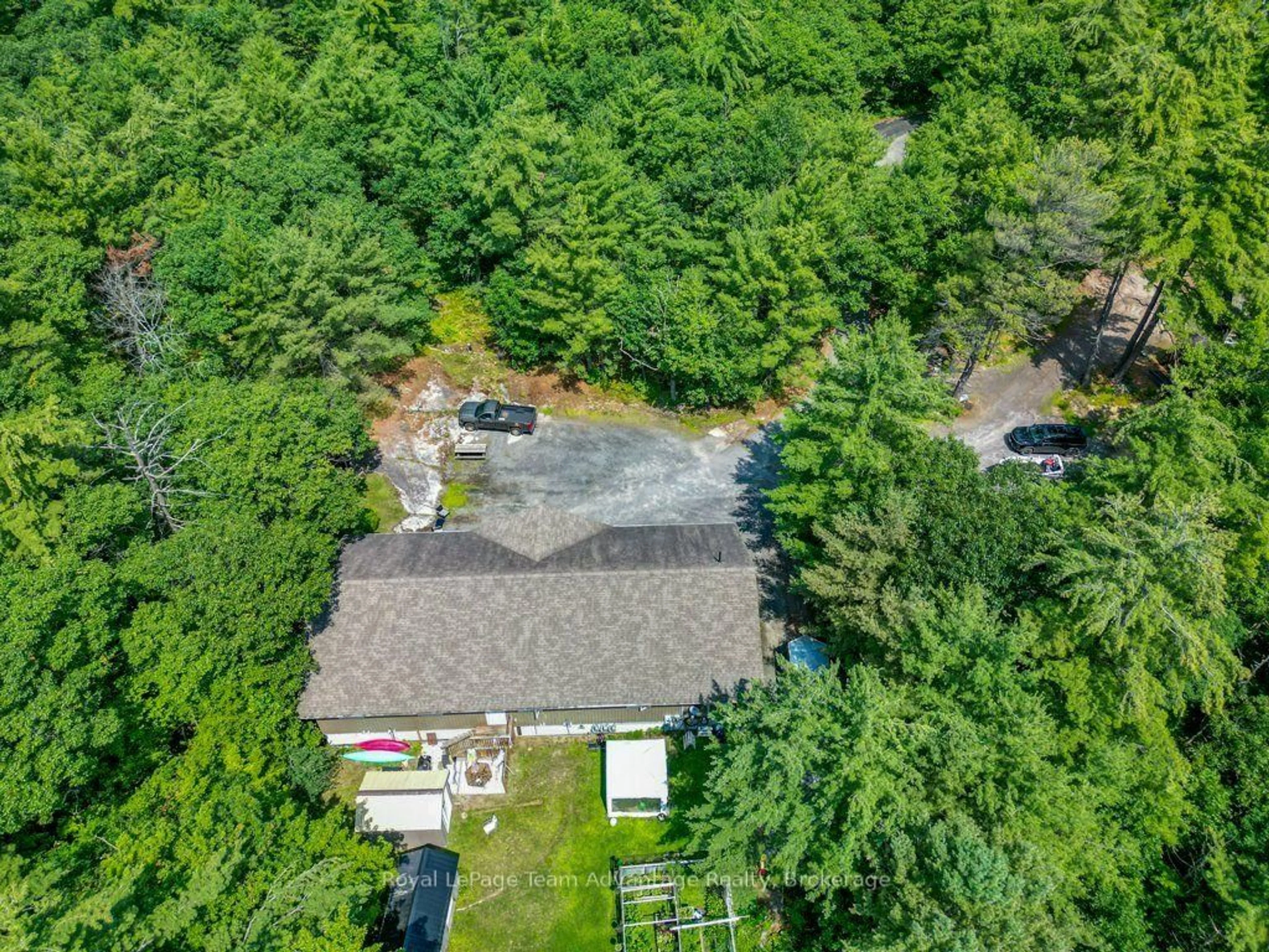 A pic from outside/outdoor area/front of a property/back of a property/a pic from drone, forest/trees view for 30 Hanna Rd, Parry Sound Ontario P2A 1R2