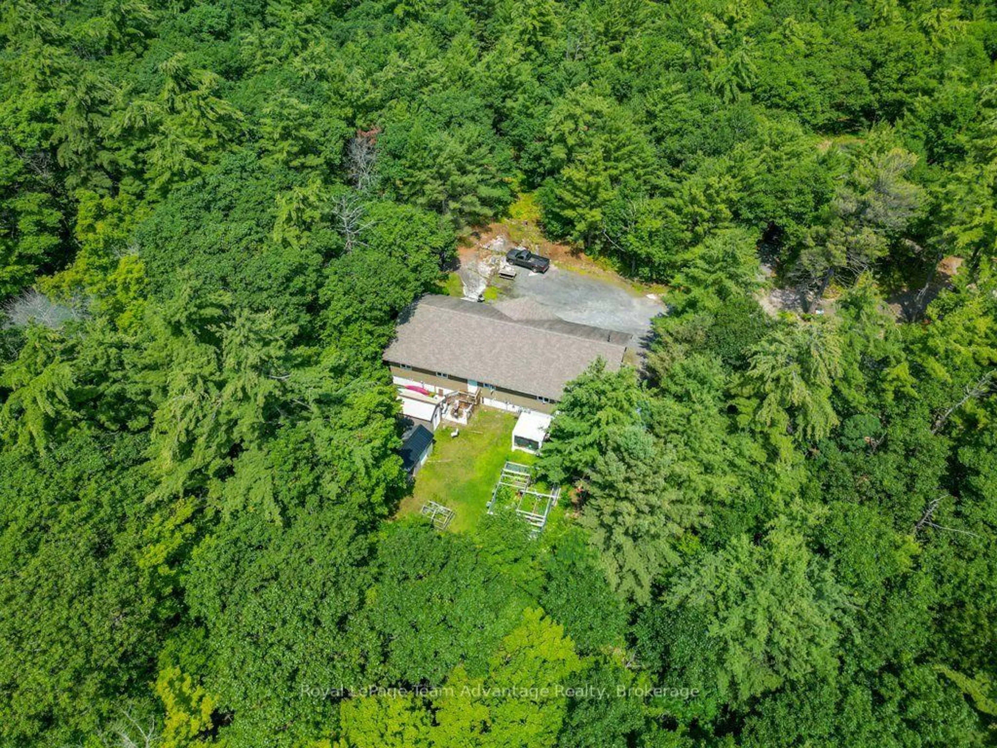 A pic from outside/outdoor area/front of a property/back of a property/a pic from drone, forest/trees view for 30 Hanna Rd, Parry Sound Ontario P2A 1R2