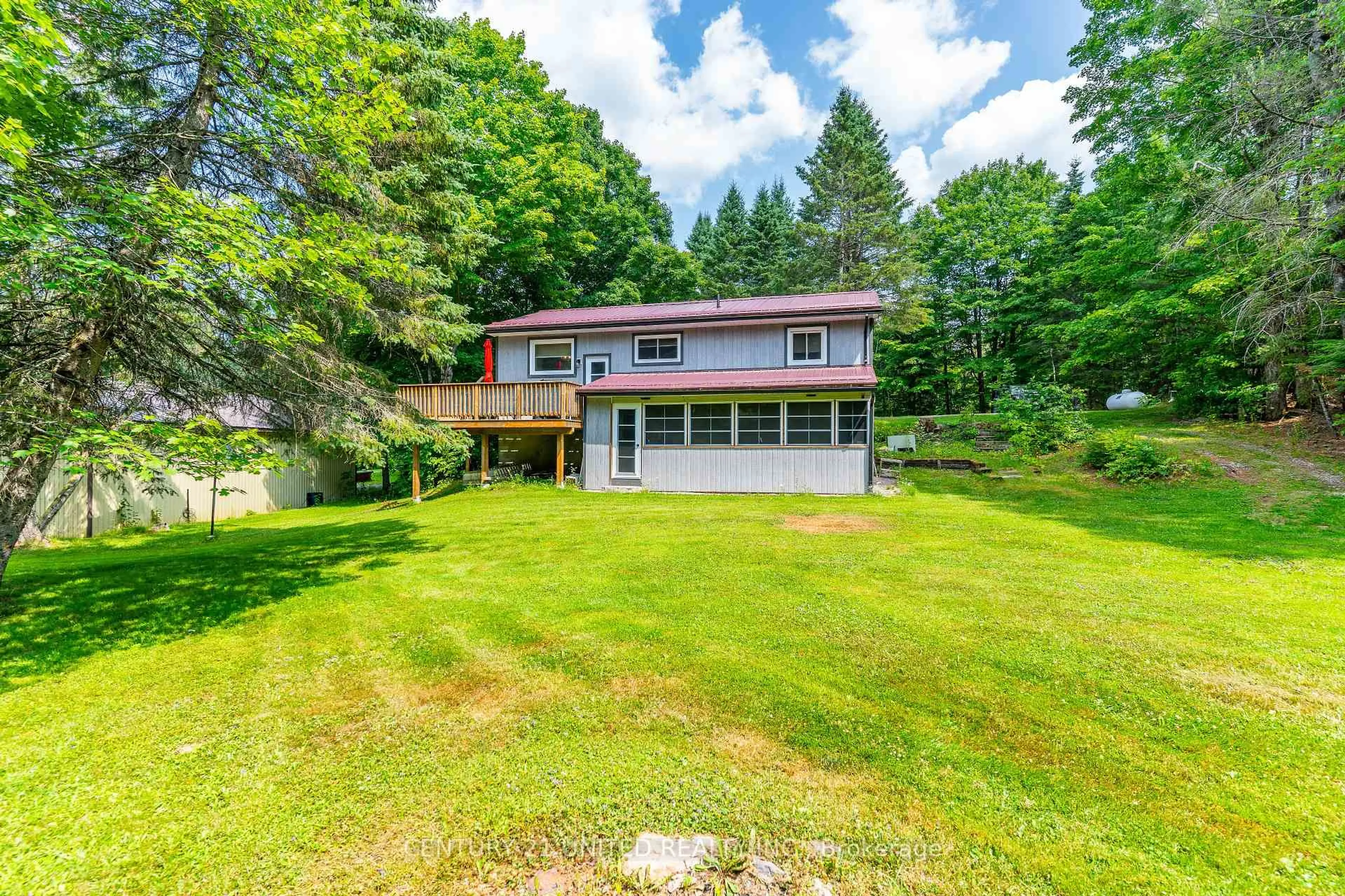 A pic from outside/outdoor area/front of a property/back of a property/a pic from drone, water/lake/river/ocean view for 1001 English Circ, Highlands East Ontario K0M 1R0