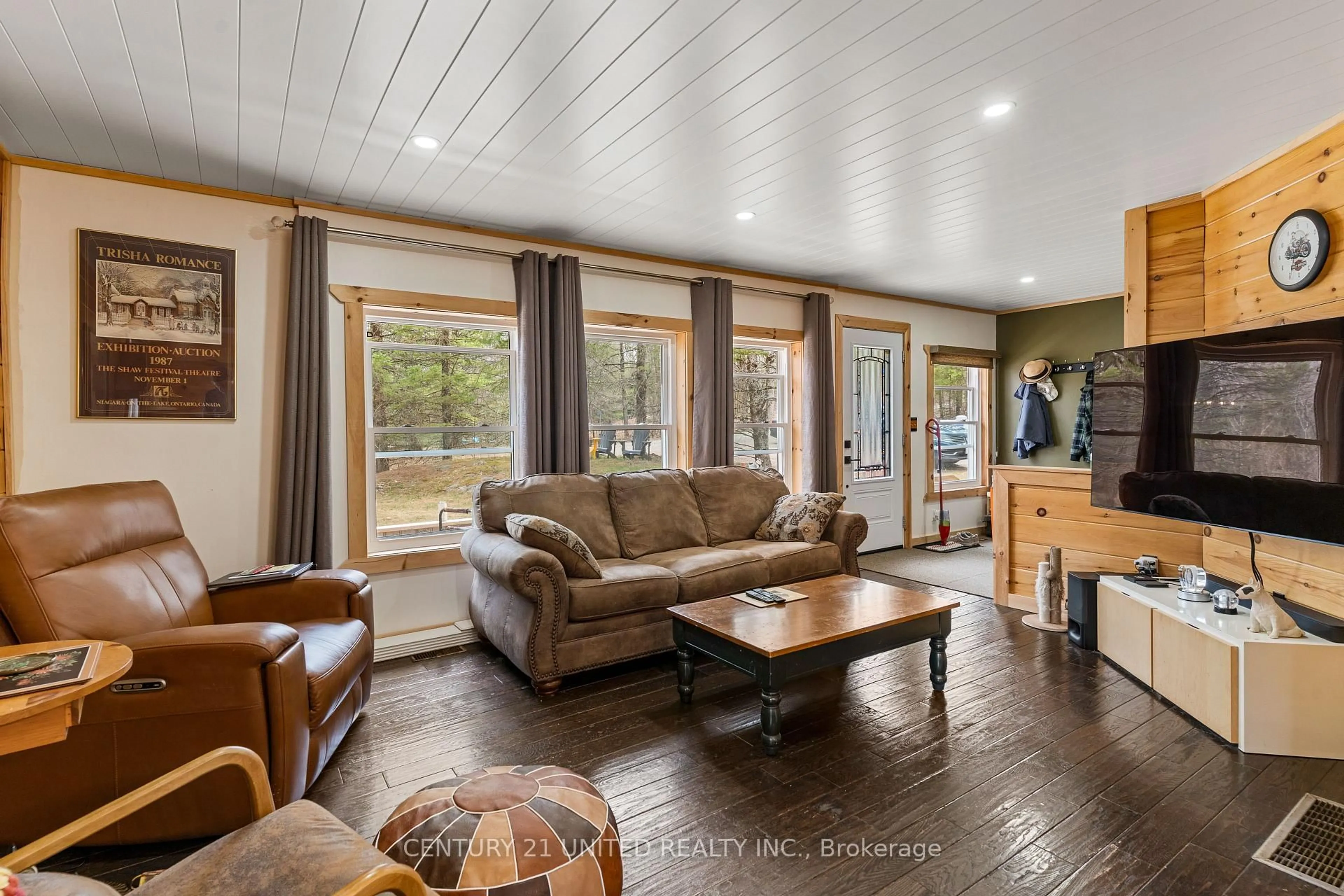 Living room with furniture, wood/laminate floor for 1001 English Circ, Highlands East Ontario K0M 1R0