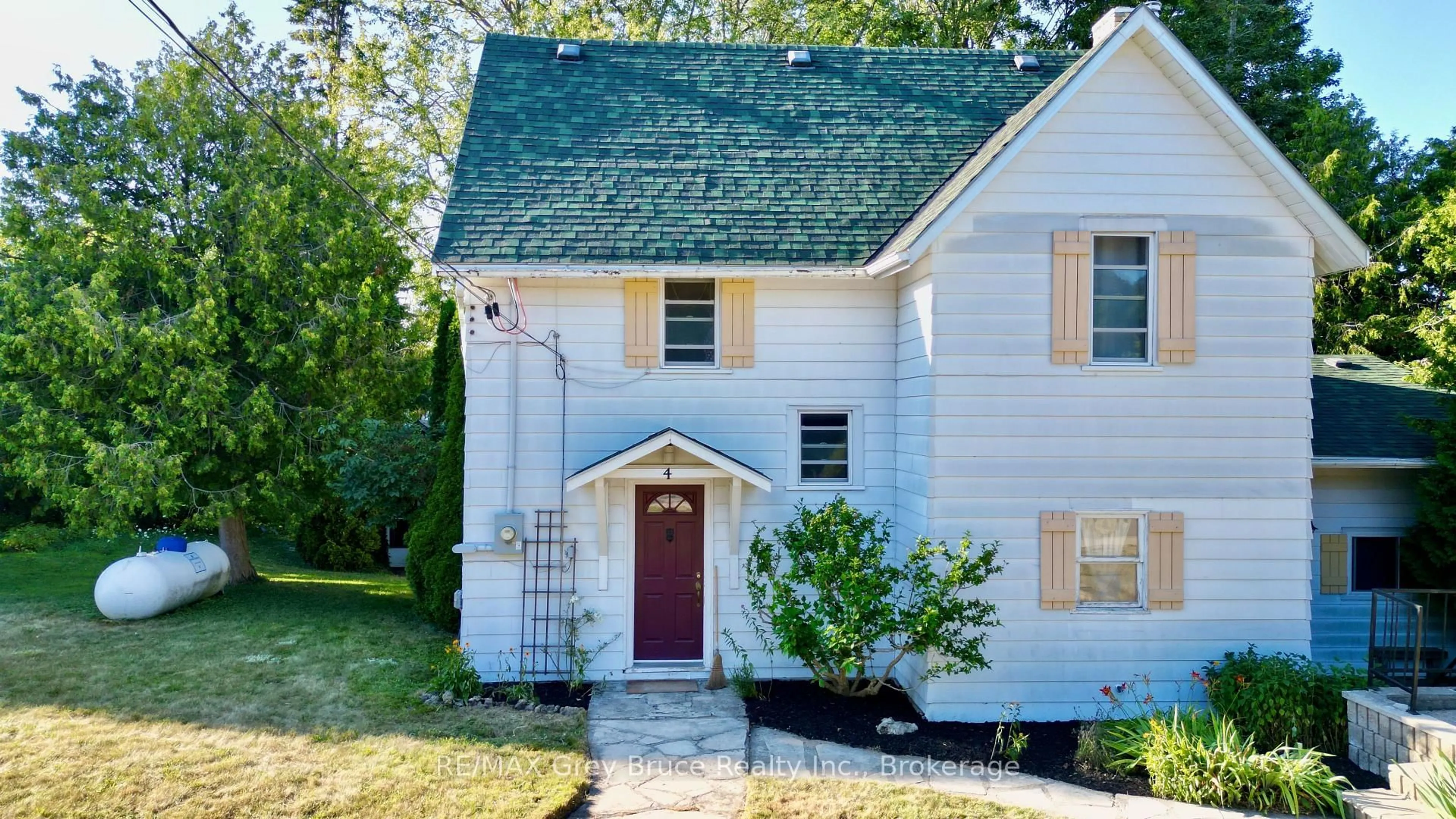 Home with vinyl exterior material, street for 4 Mill St, Northern Bruce Peninsula Ontario N0H 1W0