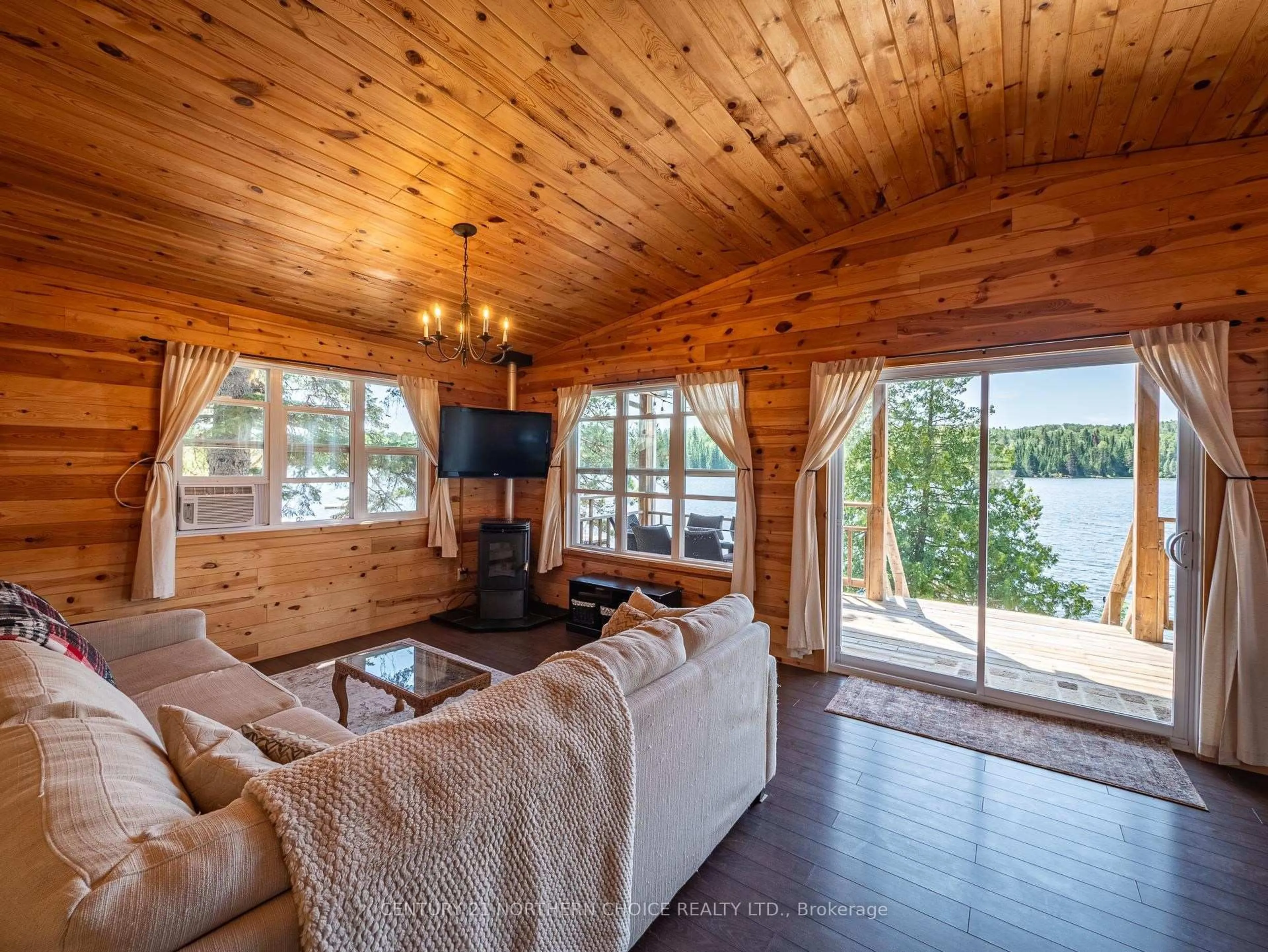 Living room with furniture, wood/laminate floor for 80 BAY POINT Rd, Kenora Ontario P0X 1H0