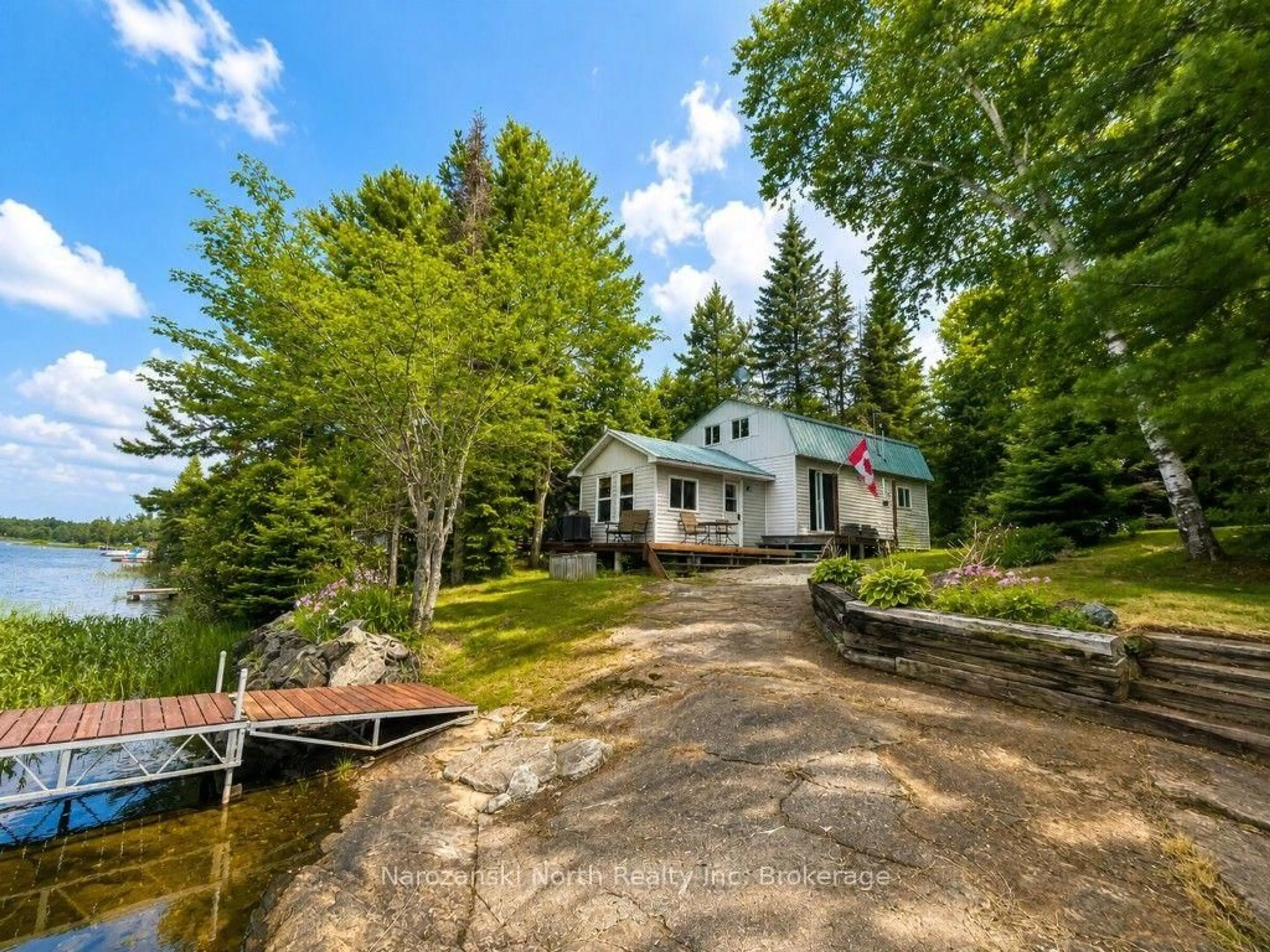 A pic from outside/outdoor area/front of a property/back of a property/a pic from drone, water/lake/river/ocean view for 98 West Ham Lake Rd, Killarney Ontario P0M 1A0