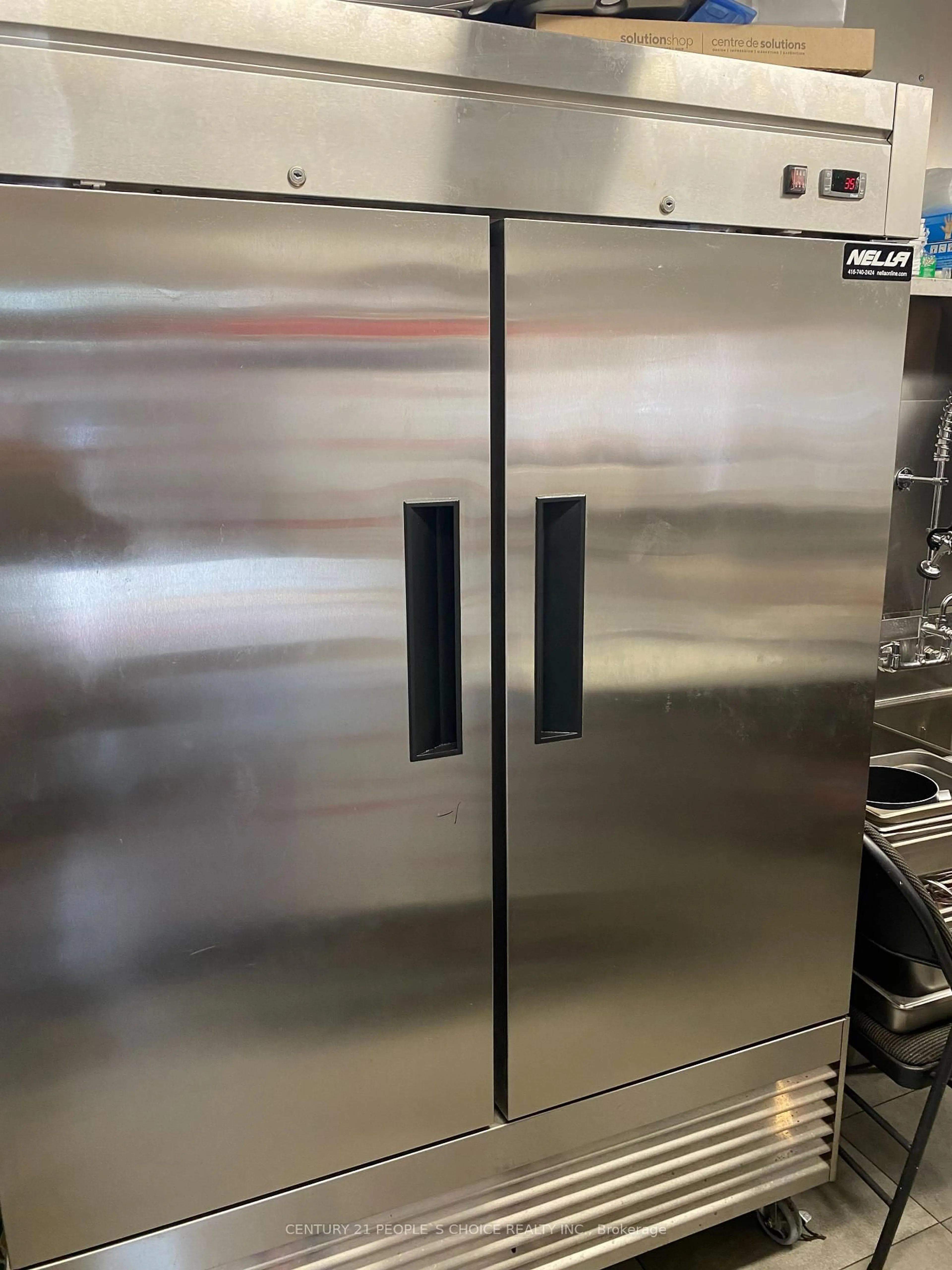 Kitchen with laundary machines, floor is not visible for 102 Parkdale Ave, Hamilton Ontario L8H 5W9