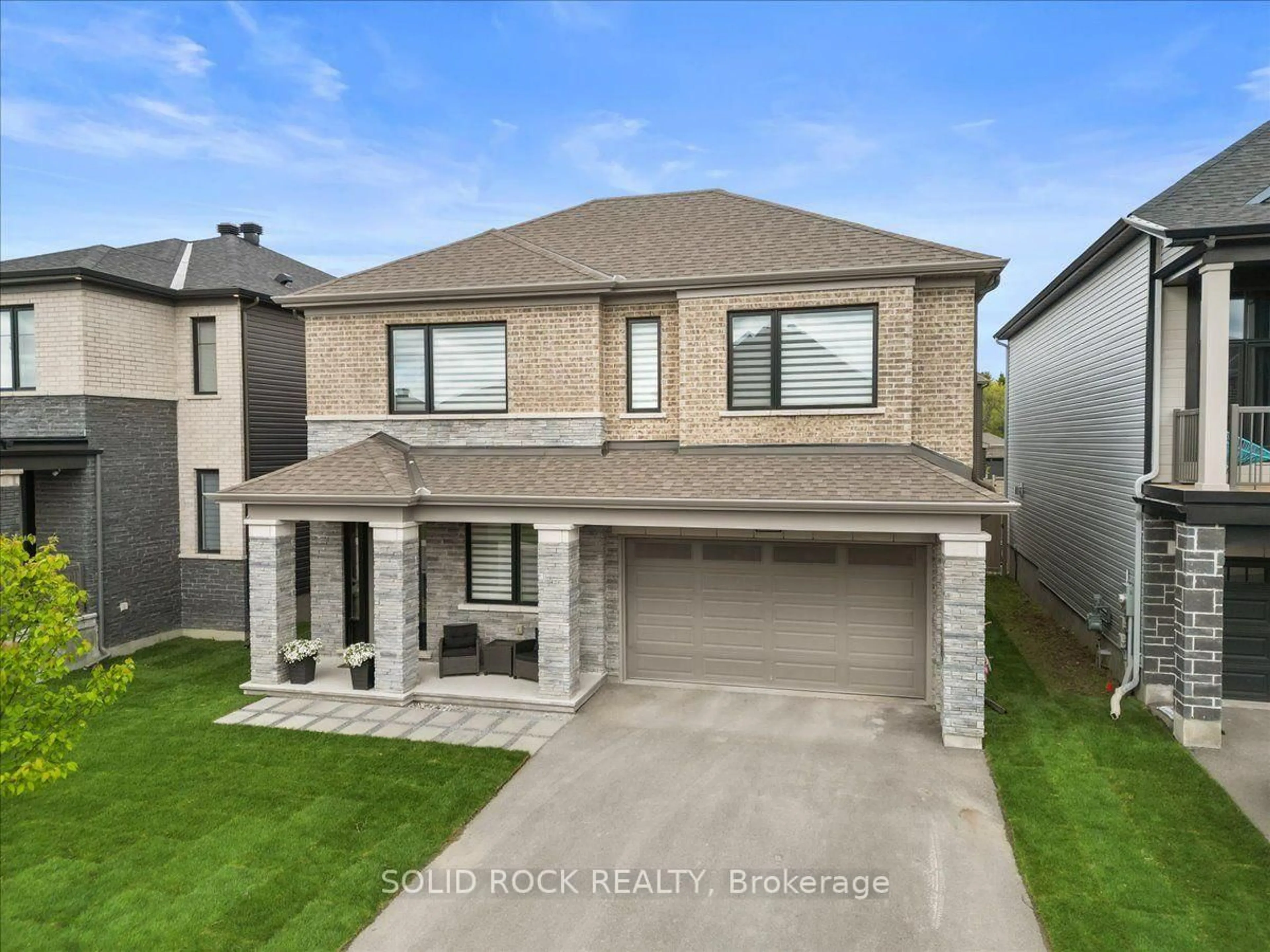 Home with brick exterior material, street for 74 Ascari Rd, Manotick Ontario K4M 0A5