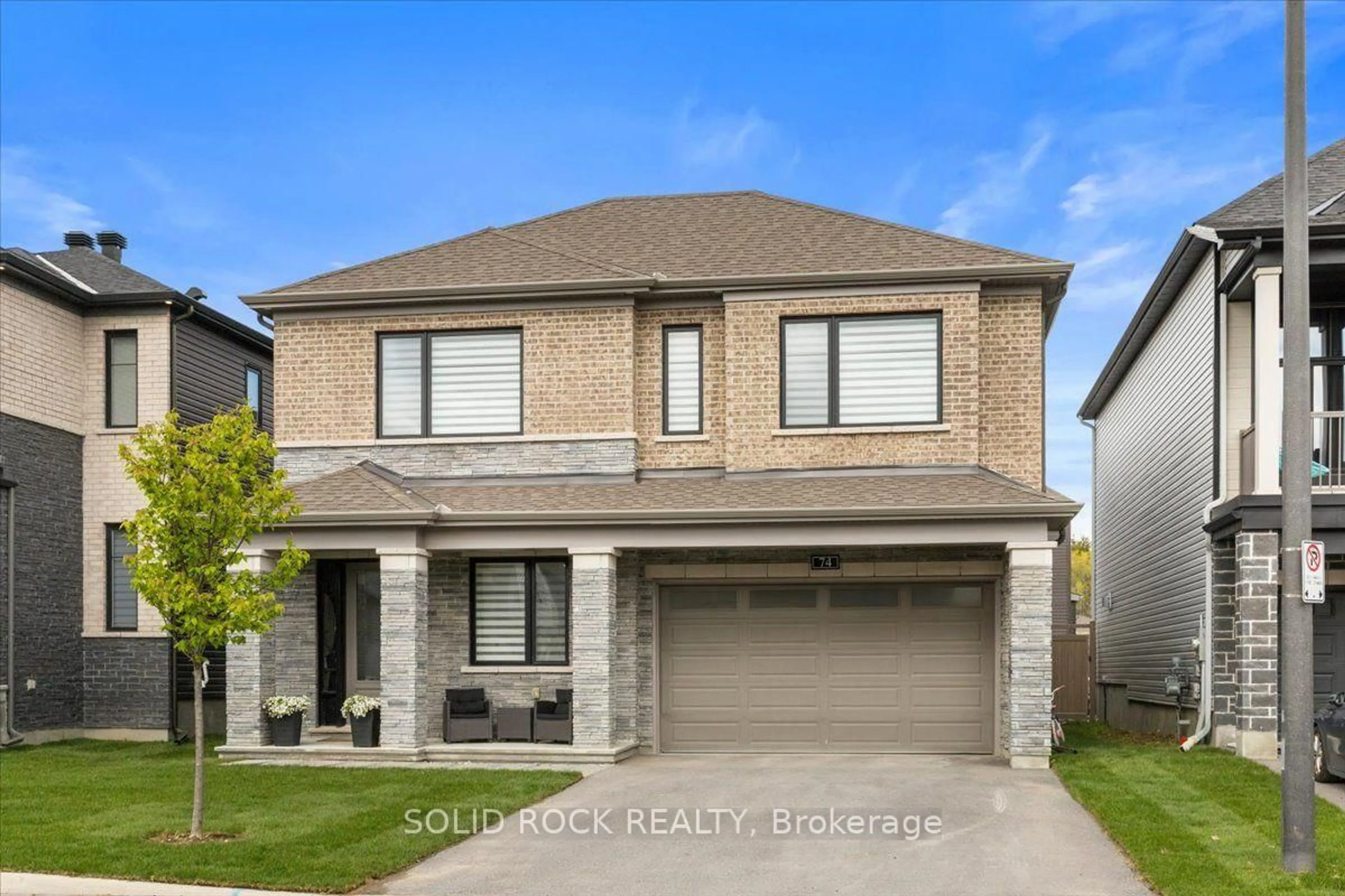 Home with brick exterior material, street for 74 Ascari Rd, Manotick Ontario K4M 0A5