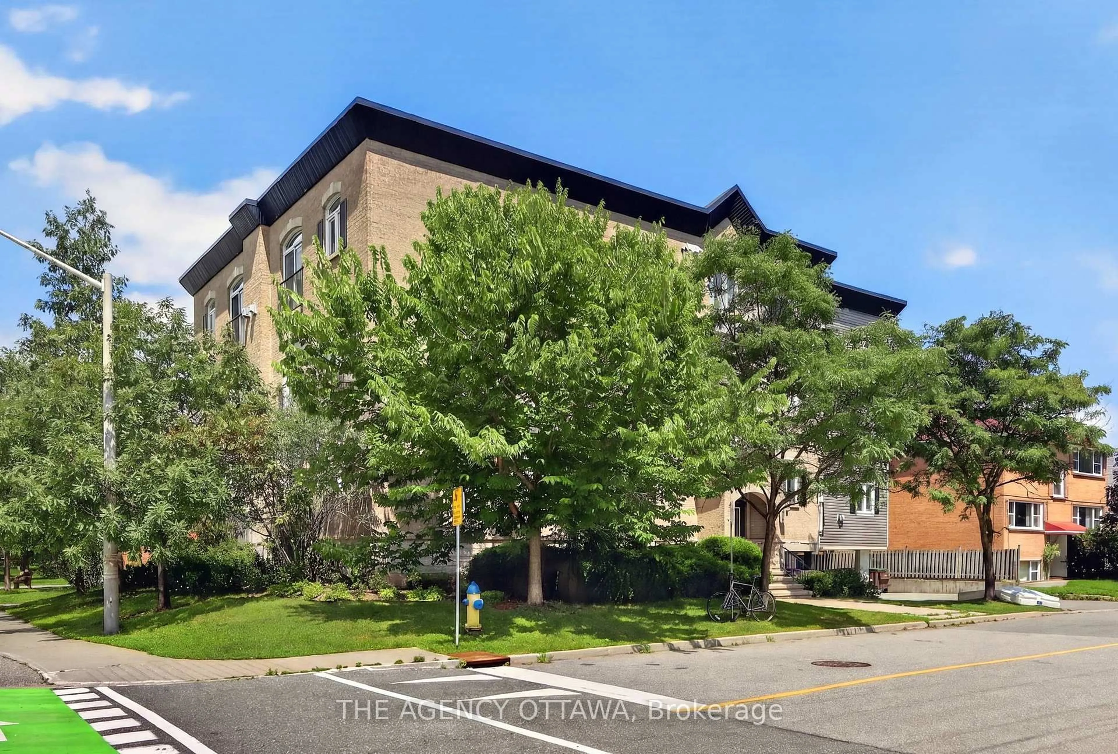 A pic from outside/outdoor area/front of a property/back of a property/a pic from drone, building for 711 Churchill Ave #203, Ottawa Ontario K1Z 7J9