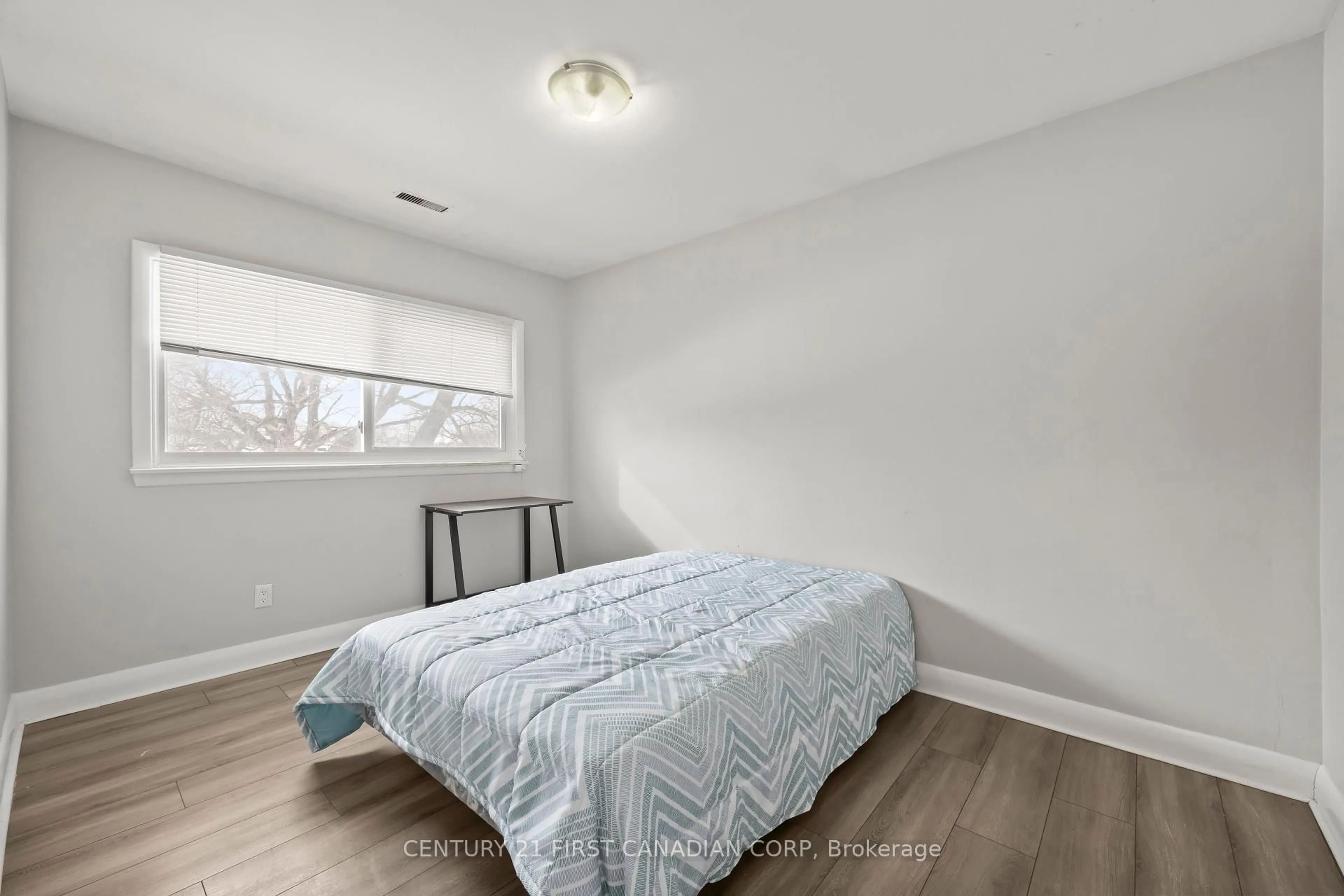 Bedroom with bed, wood/laminate floor for 664 Cheapside St, London East Ontario N5Y 3Y2