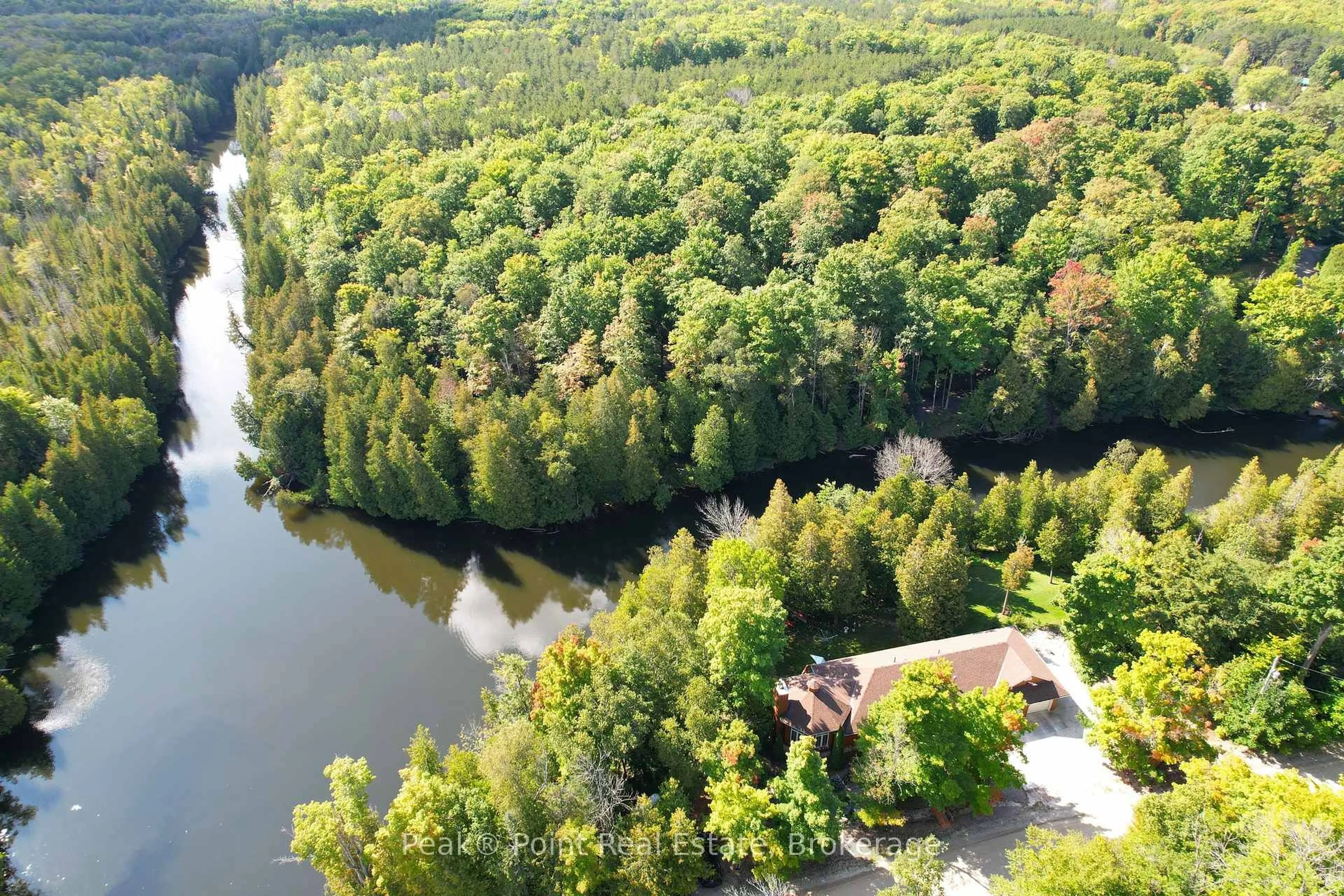 A pic from outside/outdoor area/front of a property/back of a property/a pic from drone, water/lake/river/ocean view for 38 Rankin Bridge Rd, South Bruce Peninsula Ontario N0H 2G0
