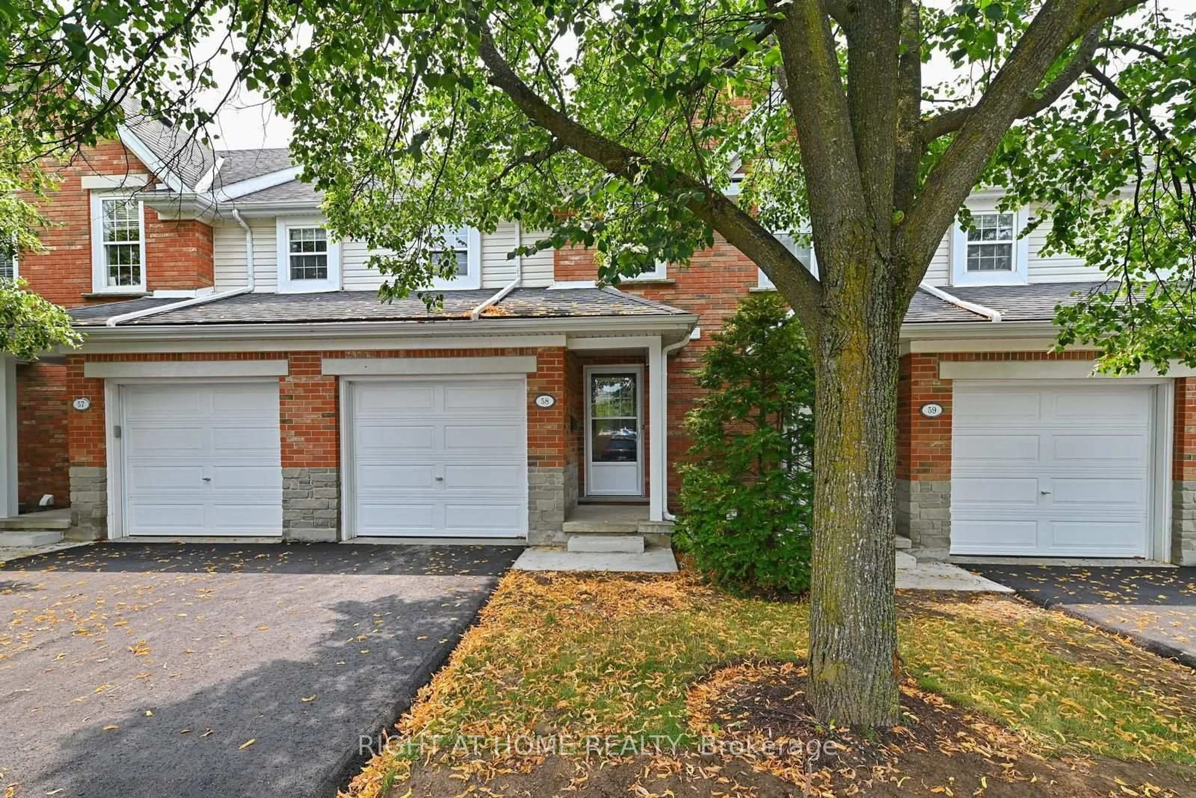 Home with brick exterior material, street for 1055 Gordon St #58, Guelph Ontario N1G 4X9