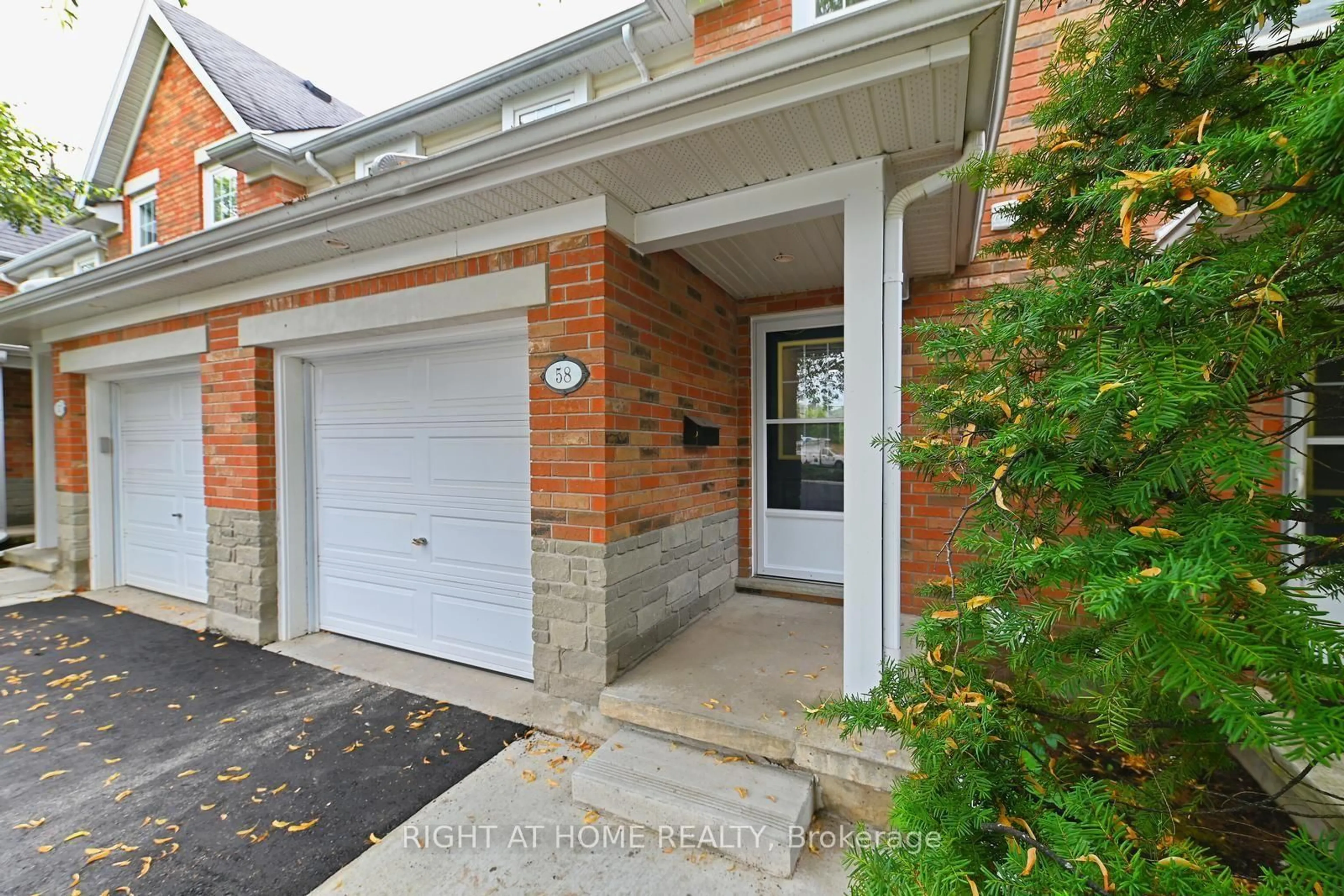 Home with brick exterior material, street for 1055 Gordon St #58, Guelph Ontario N1G 4X9