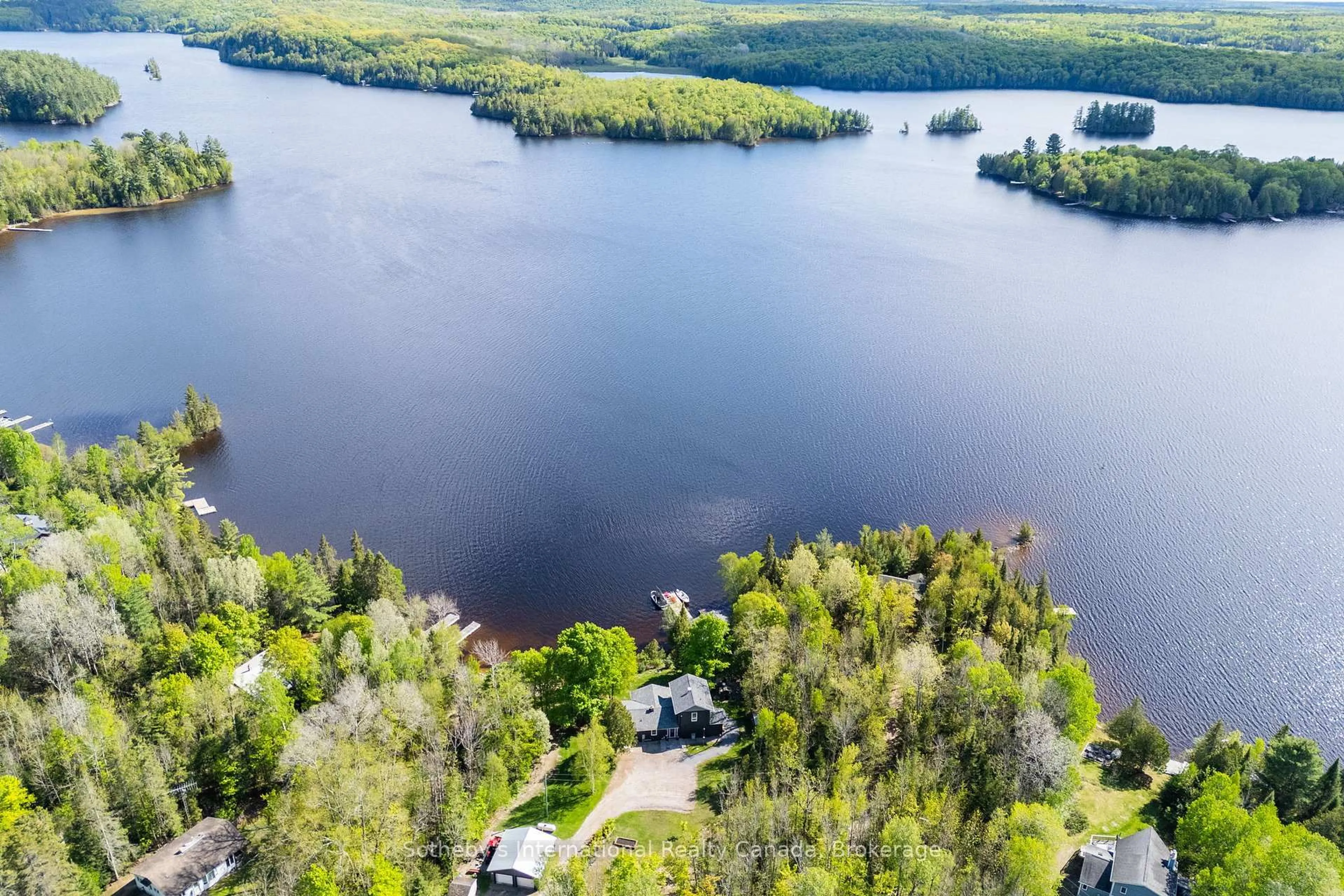 A pic from outside/outdoor area/front of a property/back of a property/a pic from drone, water/lake/river/ocean view for 126 CHAPMAN Dr, Magnetawan Ontario P0A 1P0