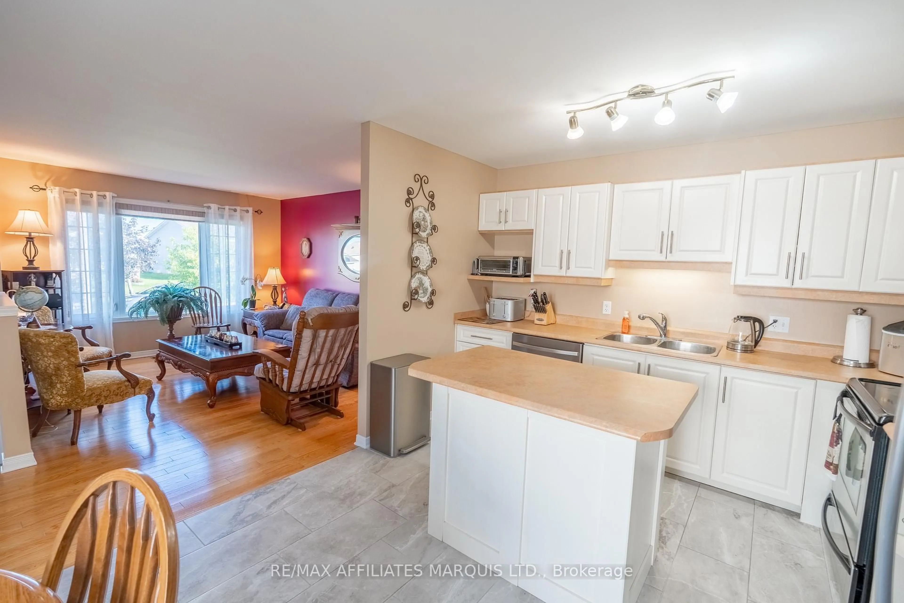 Open concept kitchen, wood/laminate floor for 1851 Cumberland St, Cornwall Ontario K6J 0A1