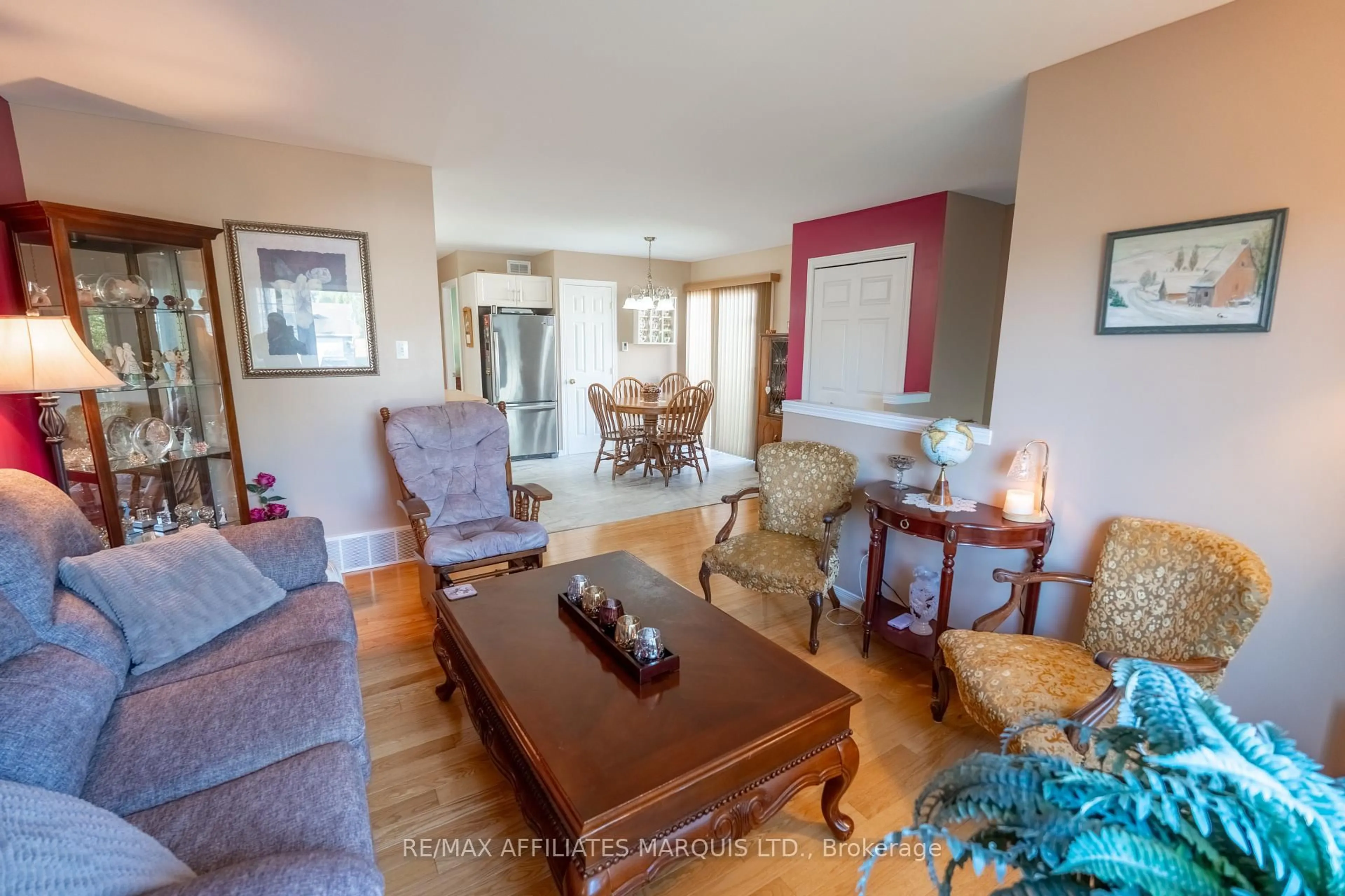 Living room with furniture, wood/laminate floor for 1851 Cumberland St, Cornwall Ontario K6J 0A1